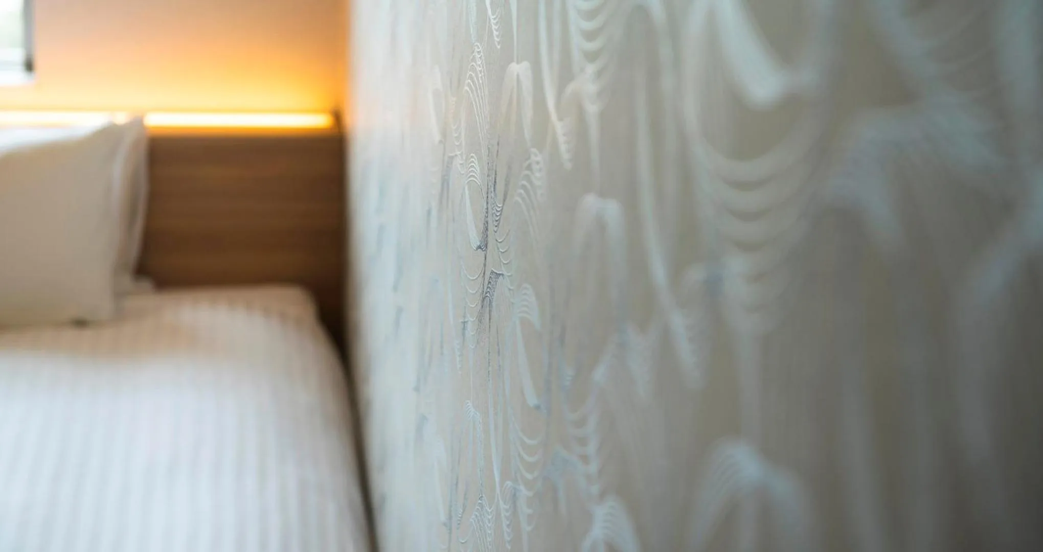 Photo of the whole room, Bed in HOTEL SANSUI NAHA Ryukyu Onsen Naminoue-No-Yu