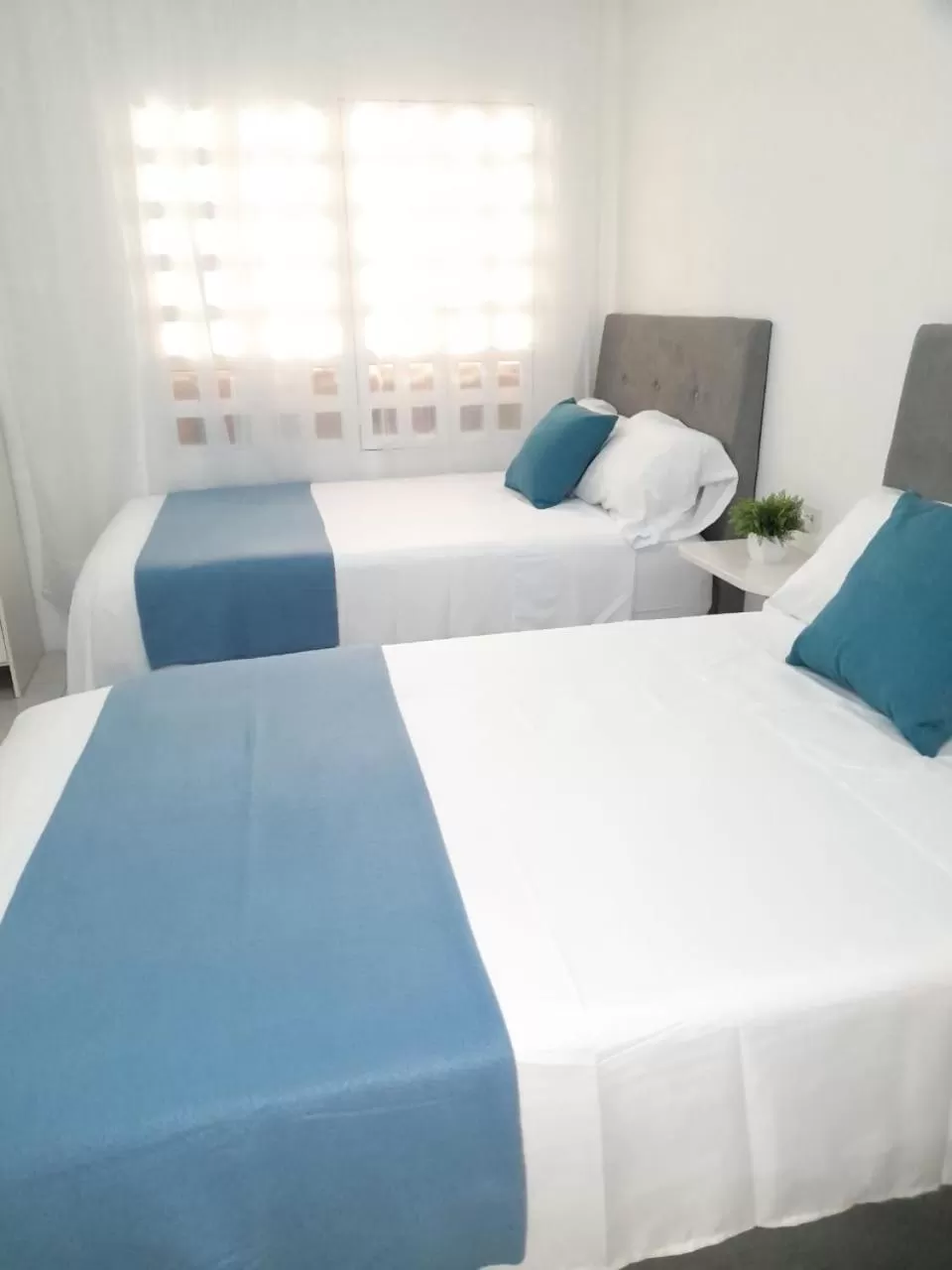 Bed in Tita’s Airport Hotel