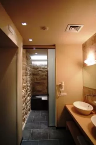 Bathroom in El Homs Palace Hotel