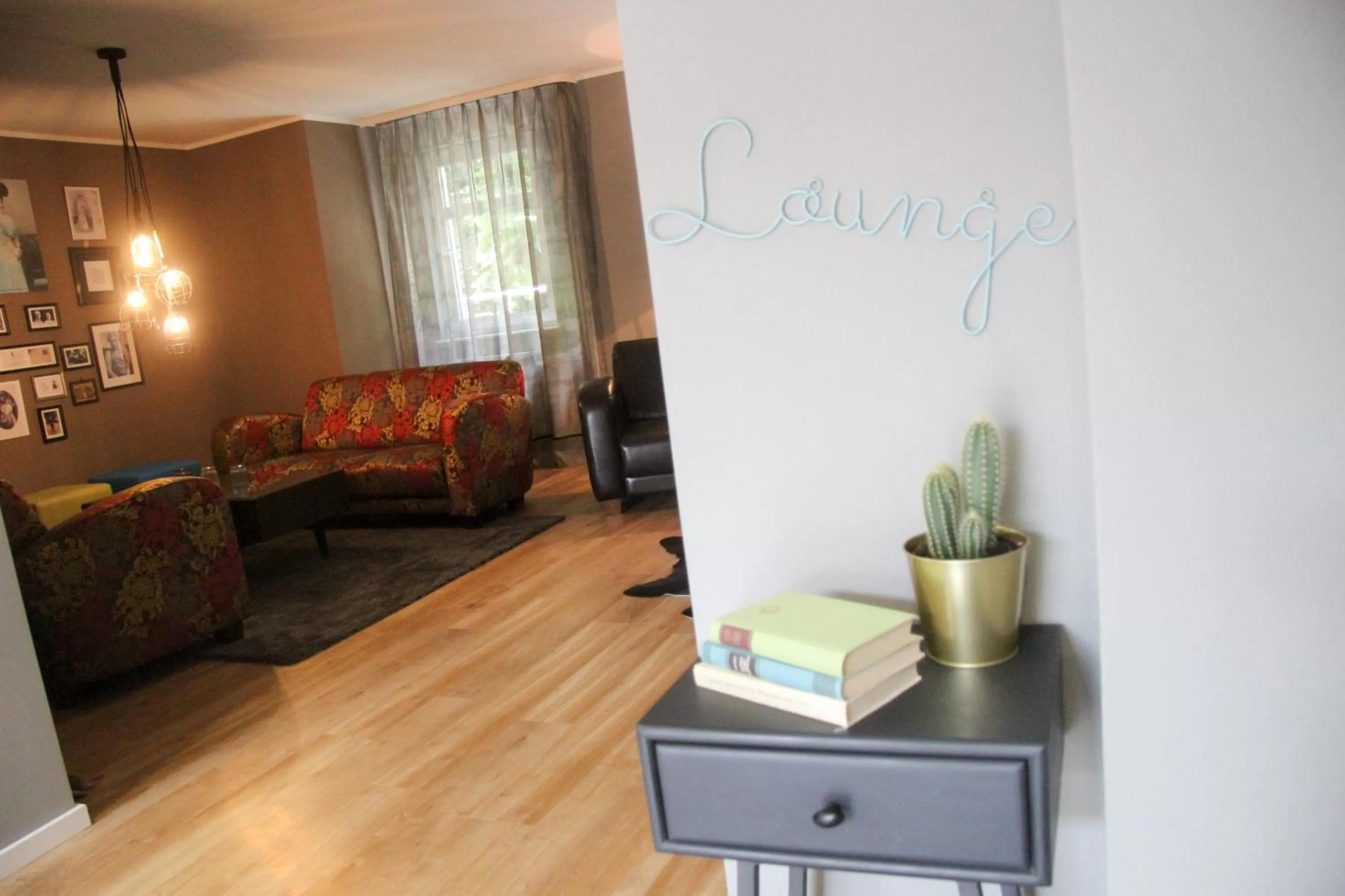 Communal lounge/ TV room in Schlossberghotel Greiz