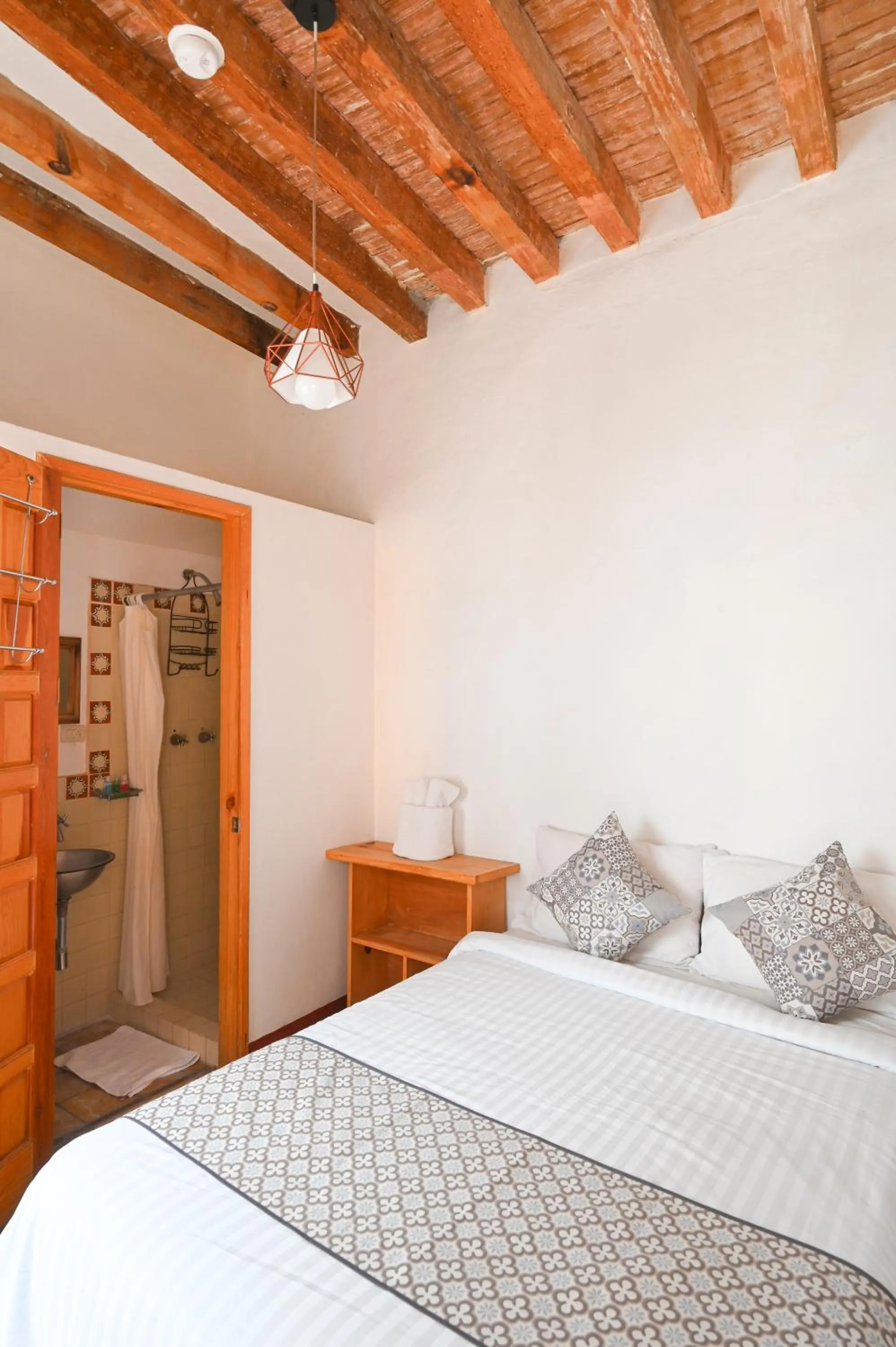 Bed in Hotel Meson Cuevano