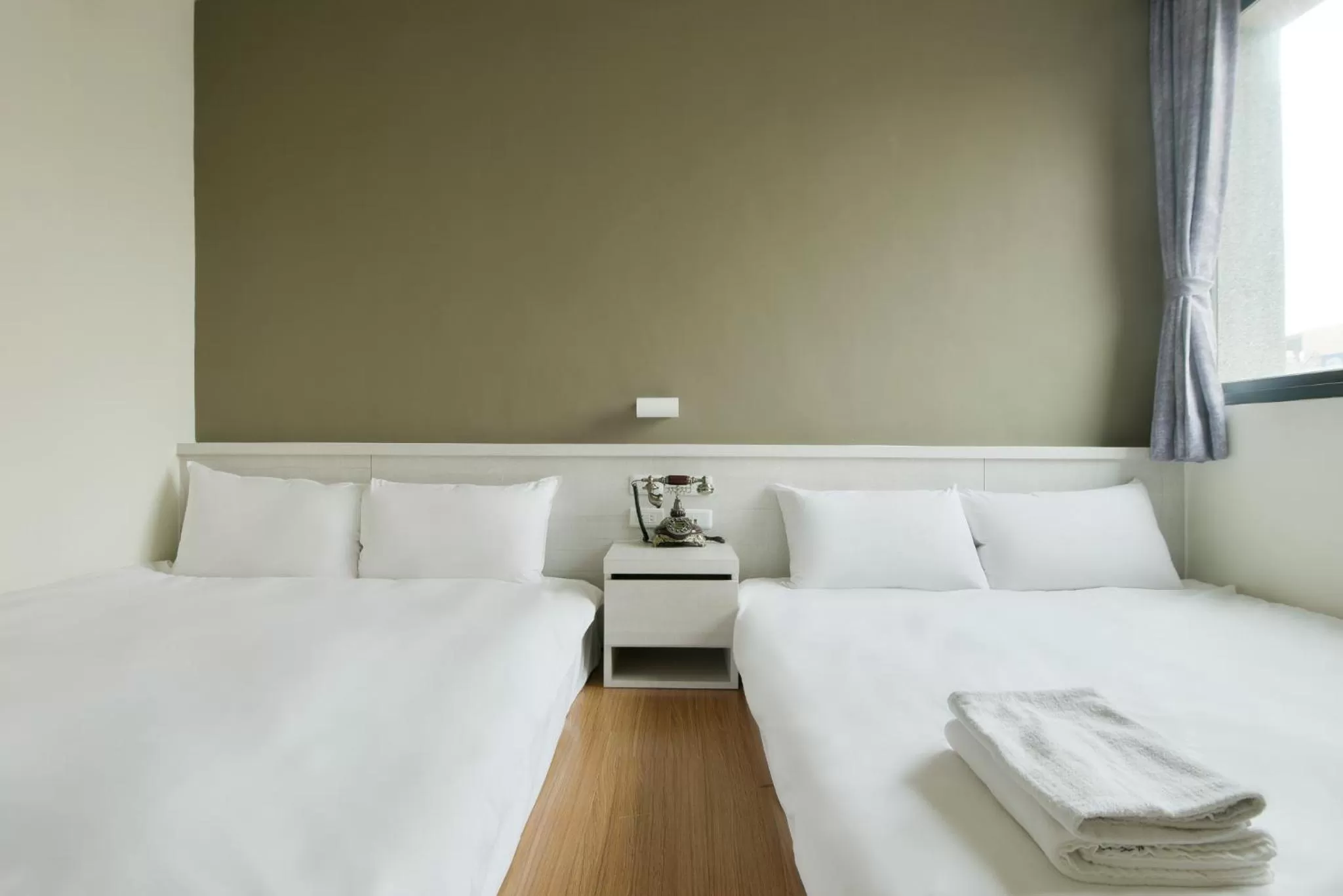 Bed in Raise Hotel Taichung