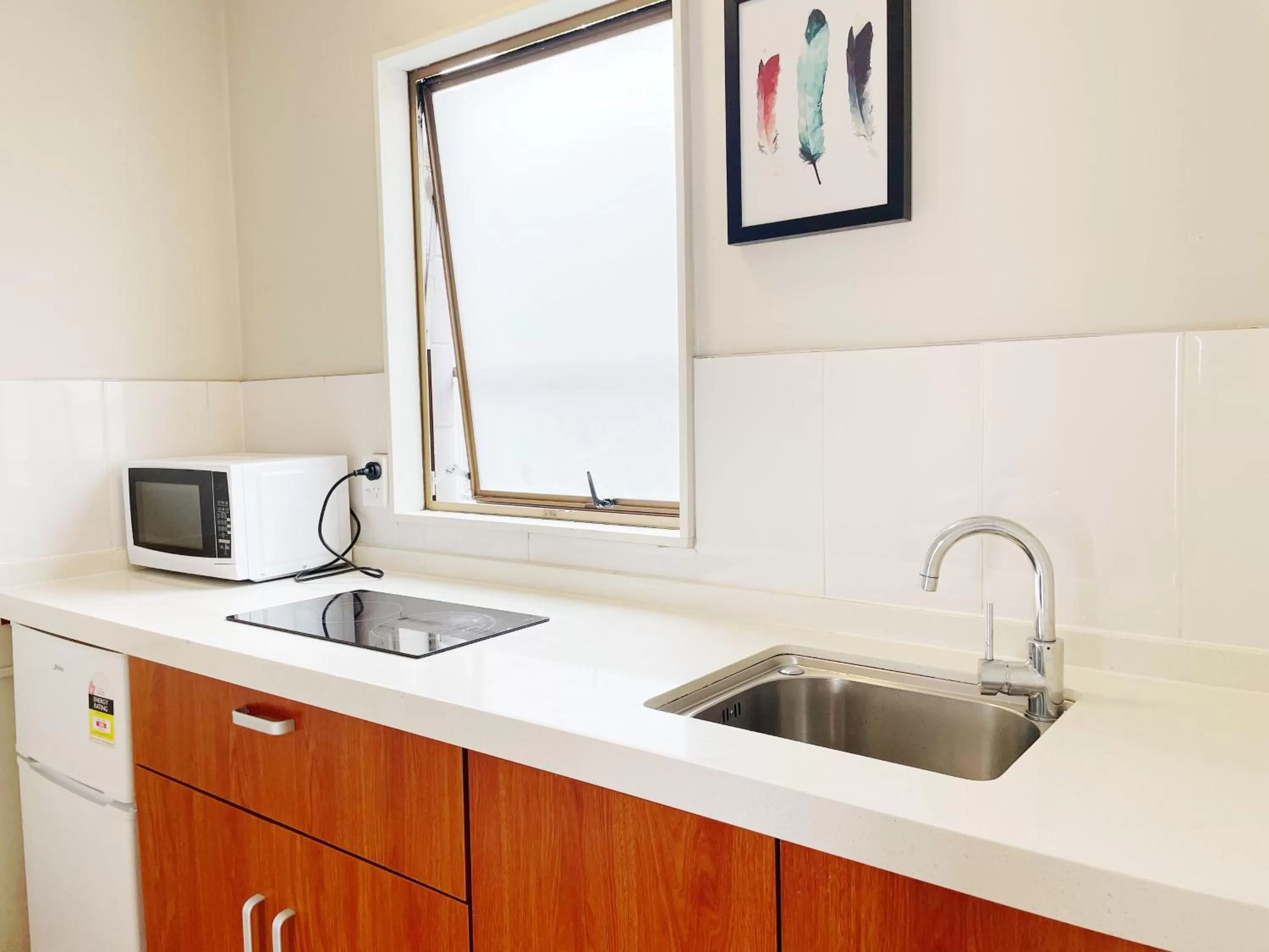 Kitchen or kitchenette in Pupuke Manor Motel