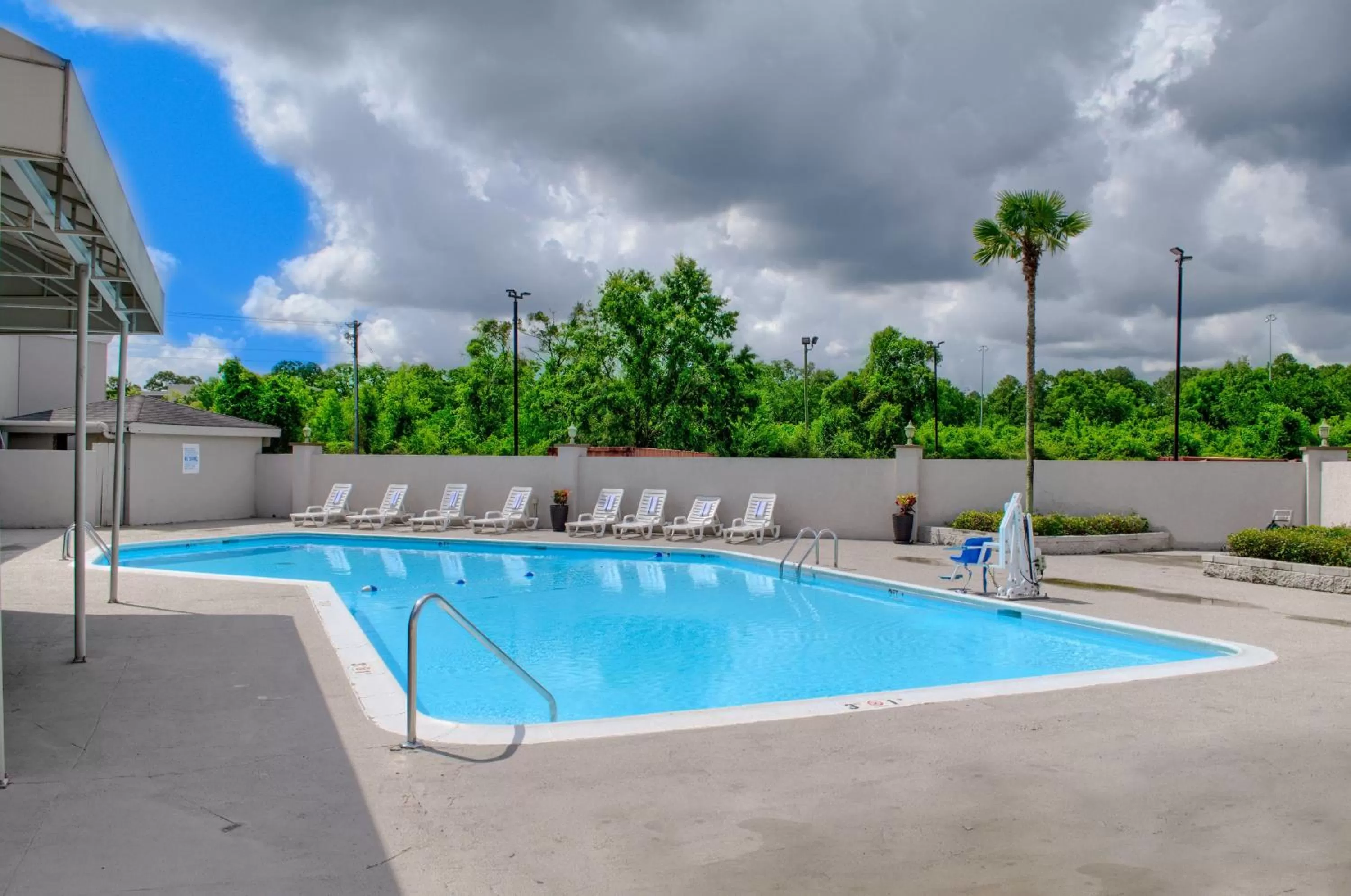 Swimming pool in Holiday Inn Mobile West I-10 by IHG