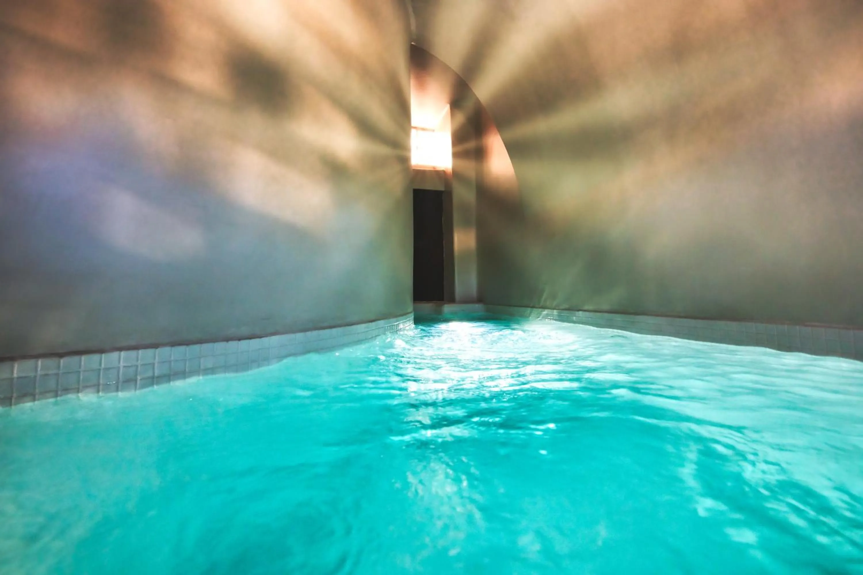 Swimming pool in San Marino Suites by Calm Collection