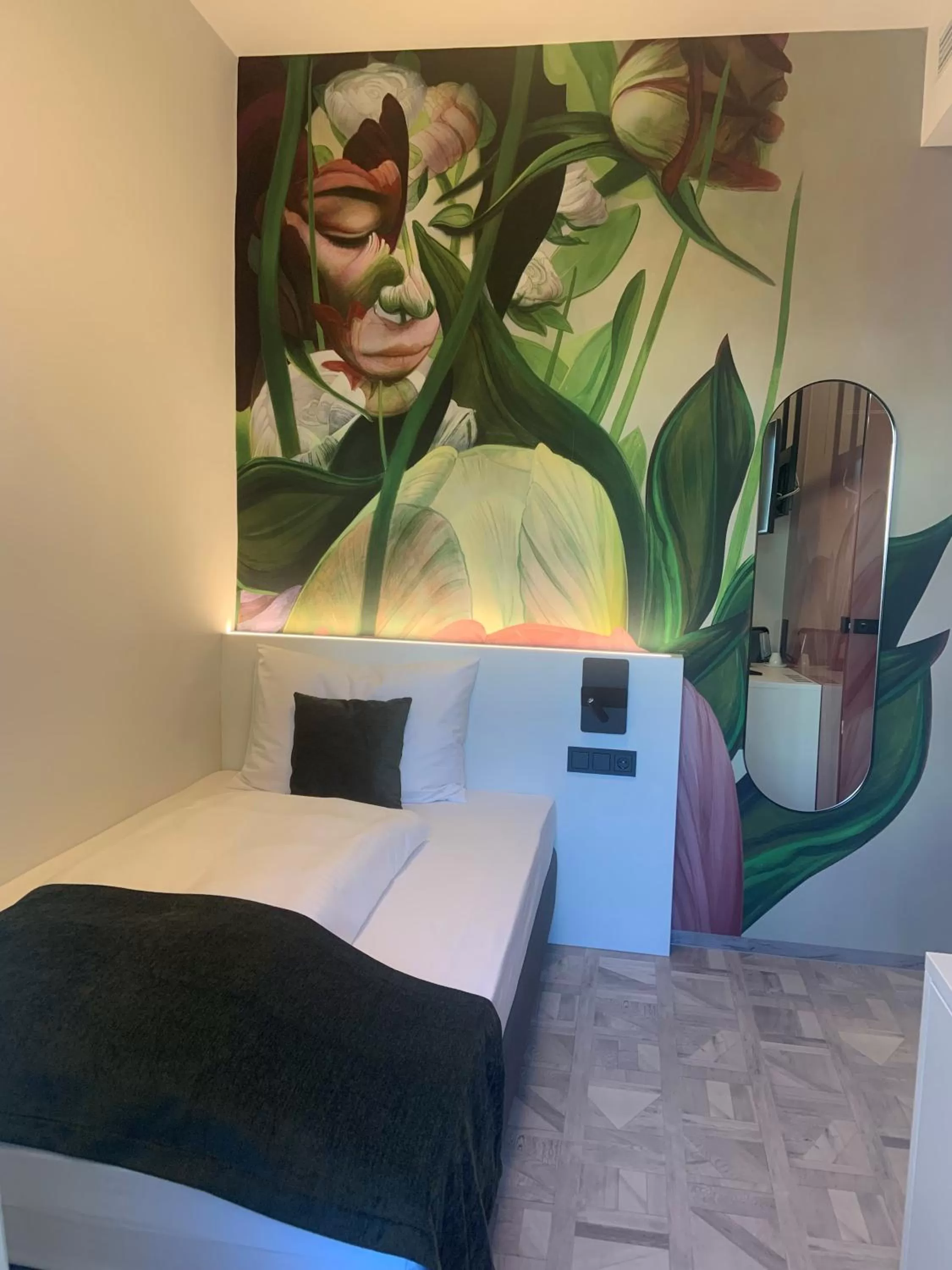 Bed in ART-INN Design Self-Check-in-Hotel