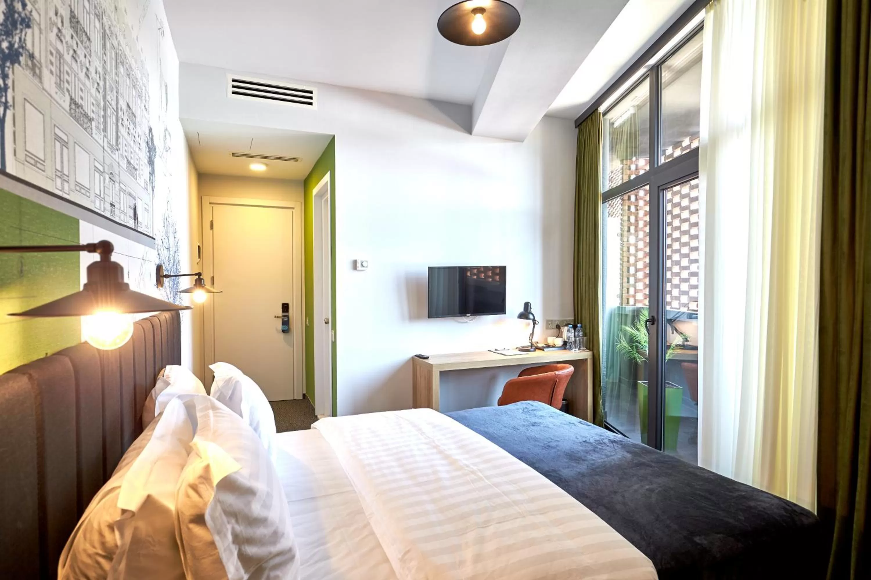 Bed in Graphica Tbilisi Hotel