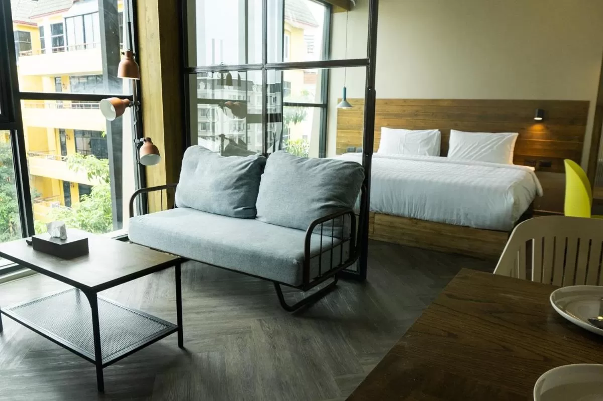 Seating area, Bed in karaarom hotel