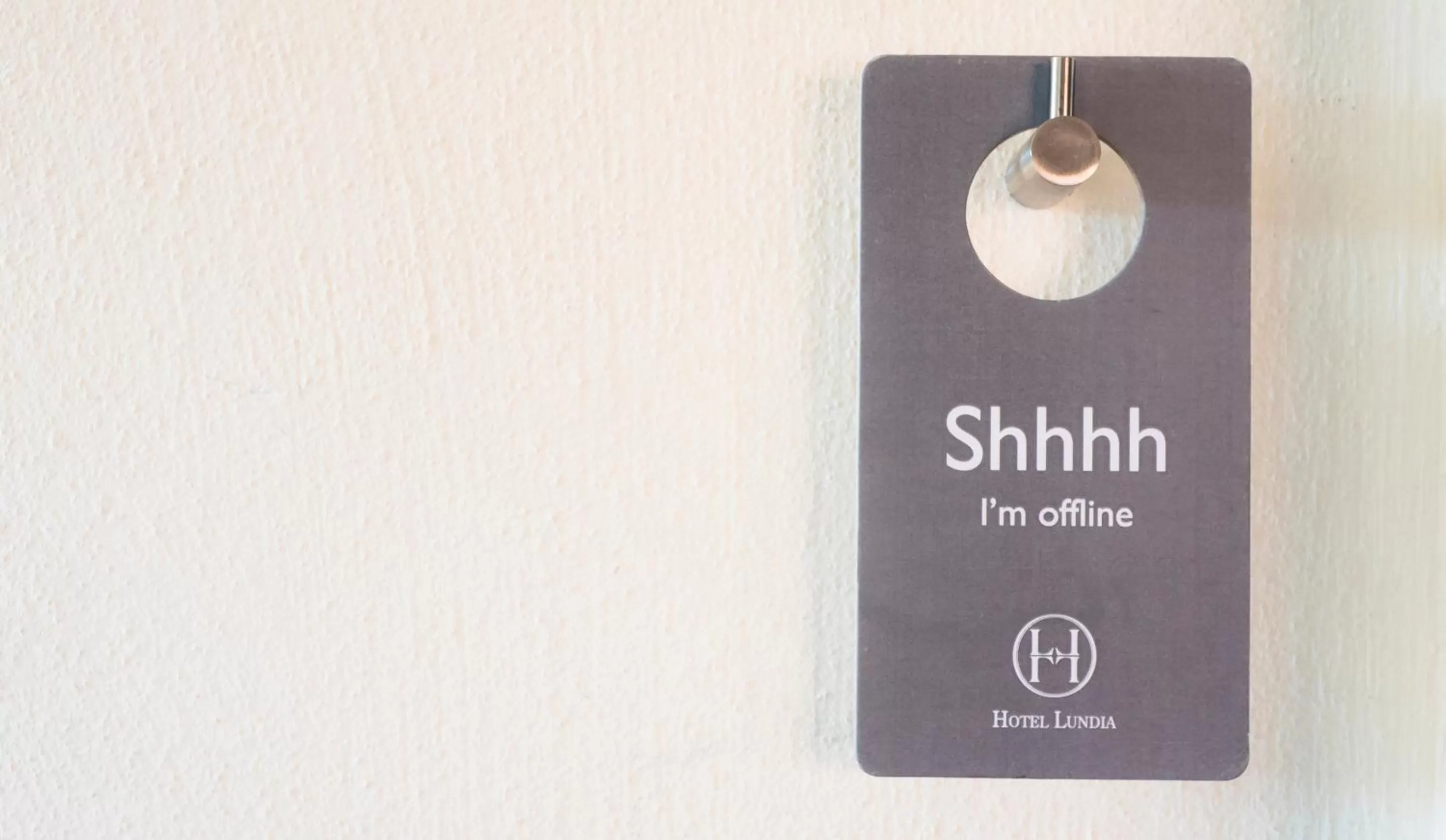 Property logo or sign in Hotel Lundia