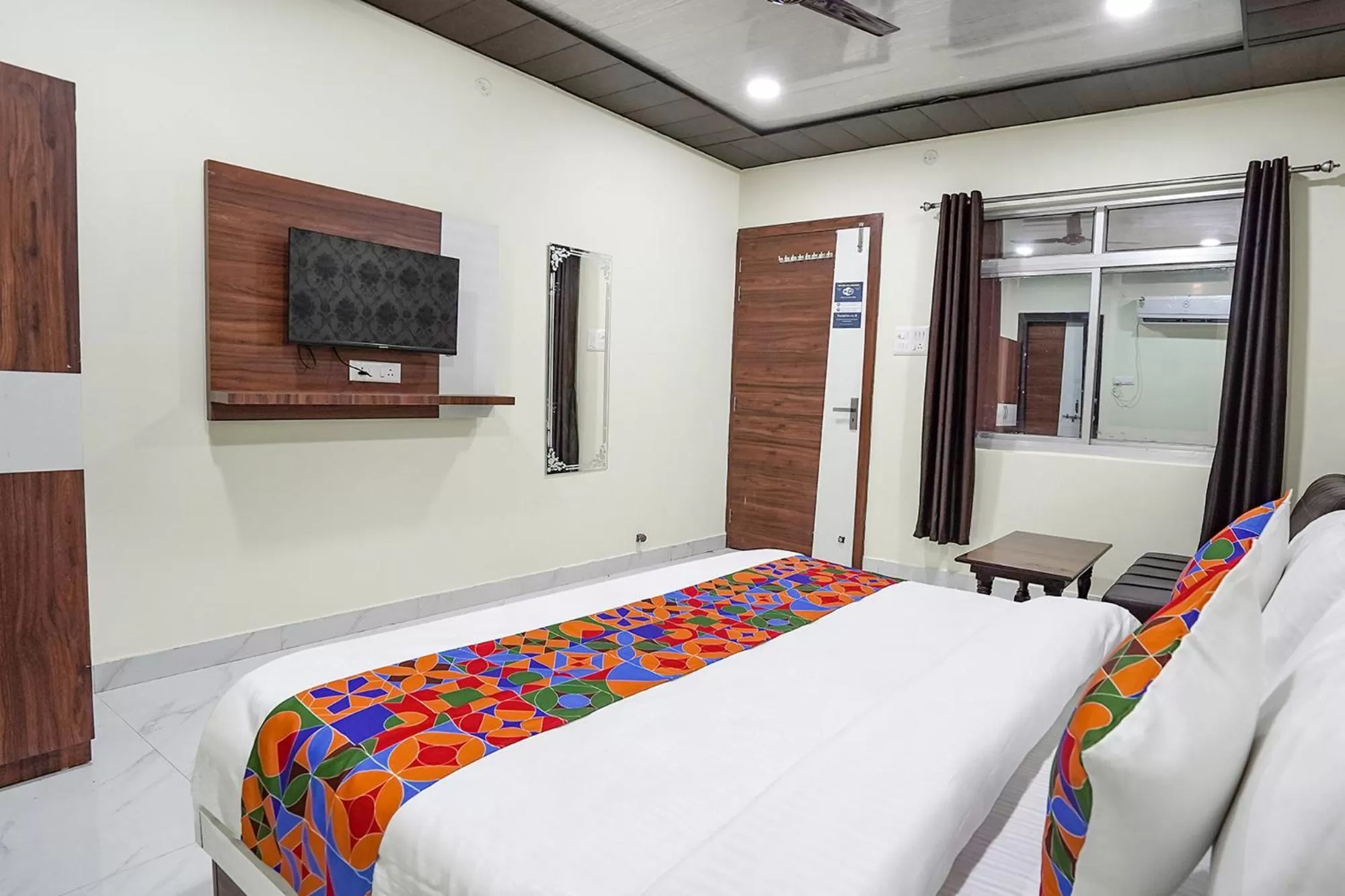 Bed in FabHotel Rajdhani