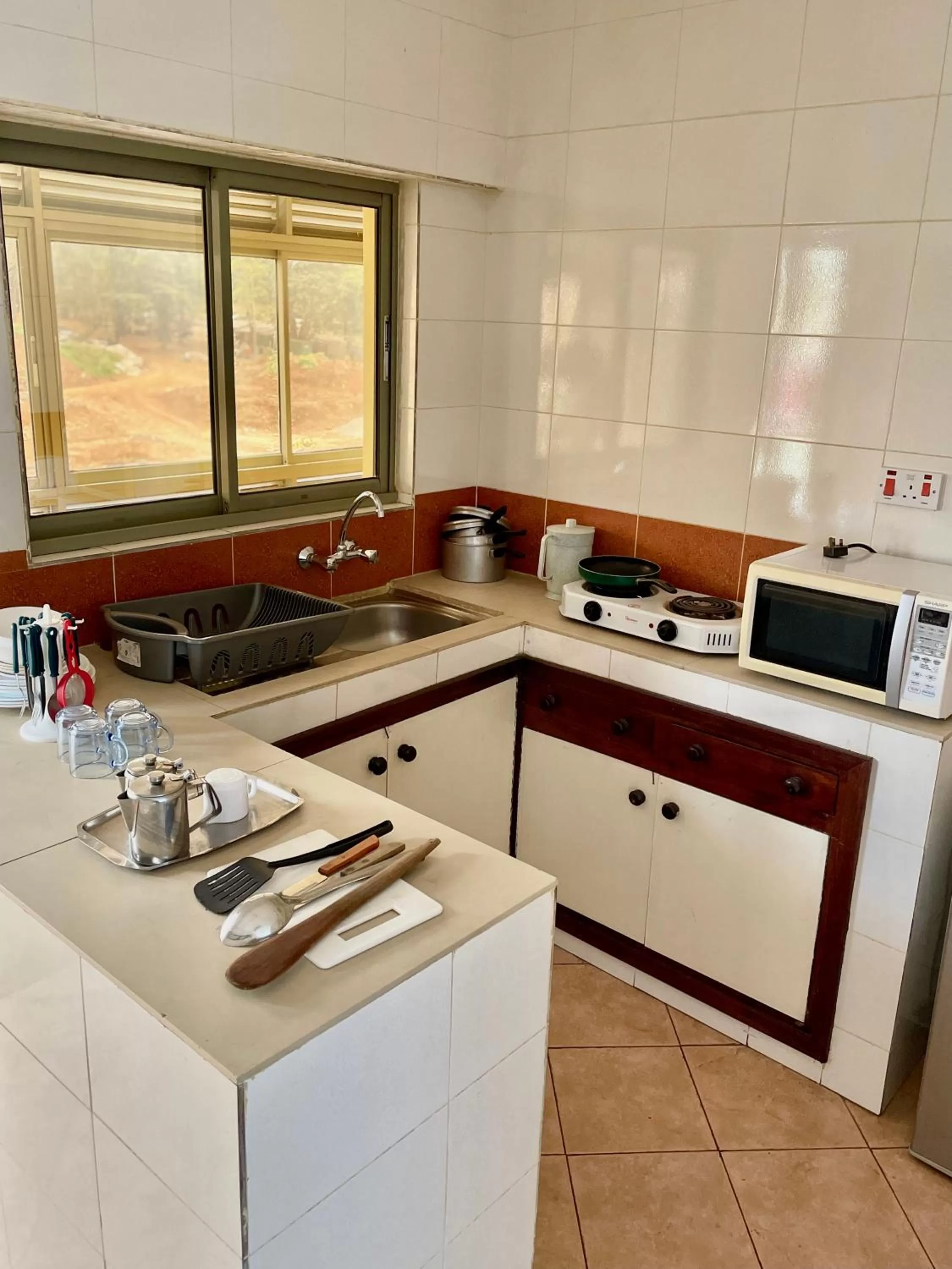 Kitchen or kitchenette in Kenya Comfort Suites