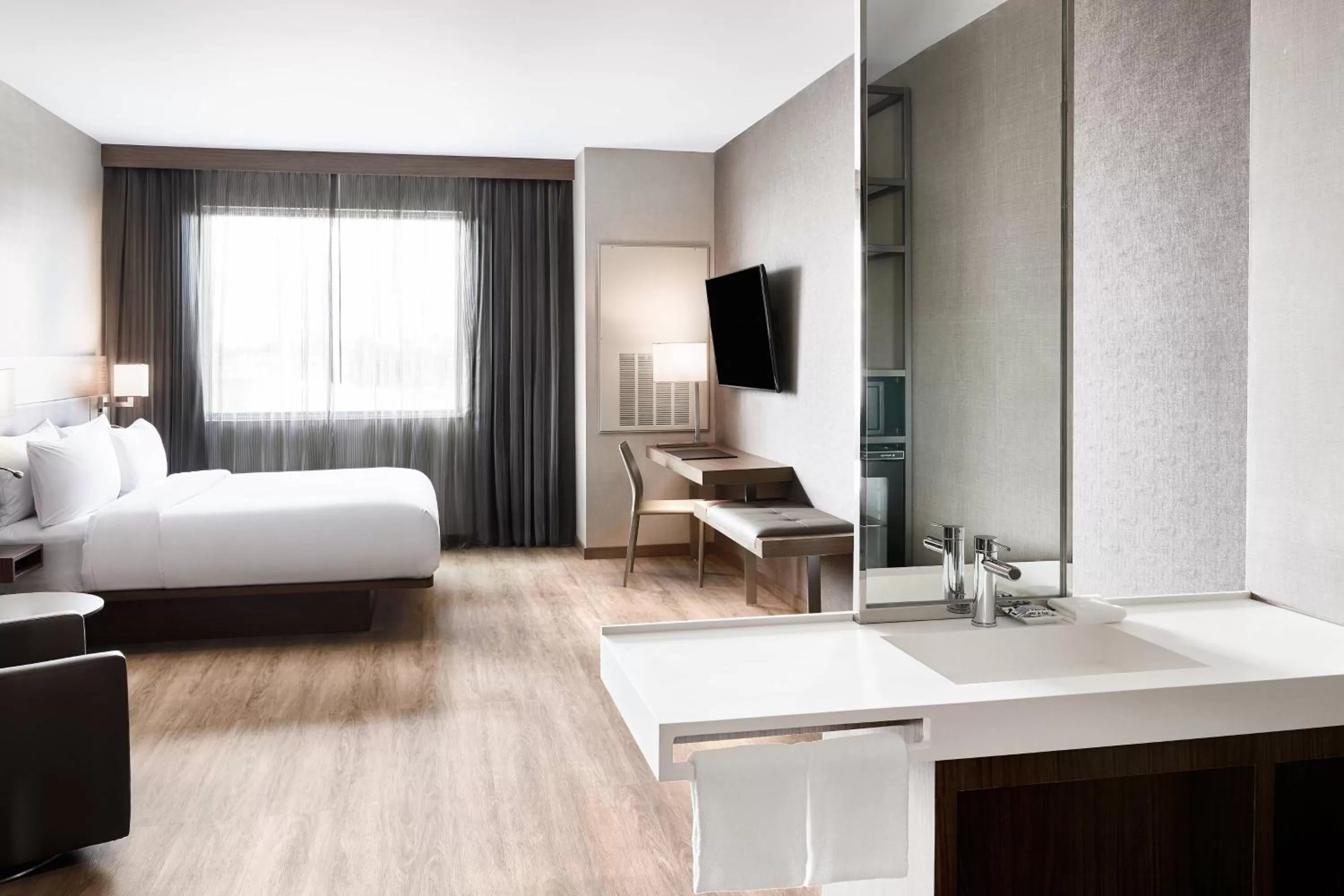 King Room with Roll-in Shower - Mobility Accessible in AC Hotel by Marriott Miami Airport West/Doral