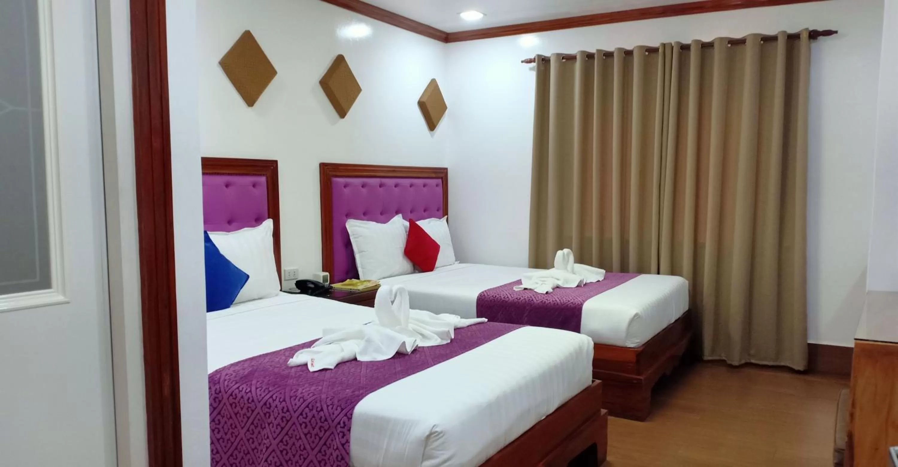 Bed in CLN Boutique Hotel