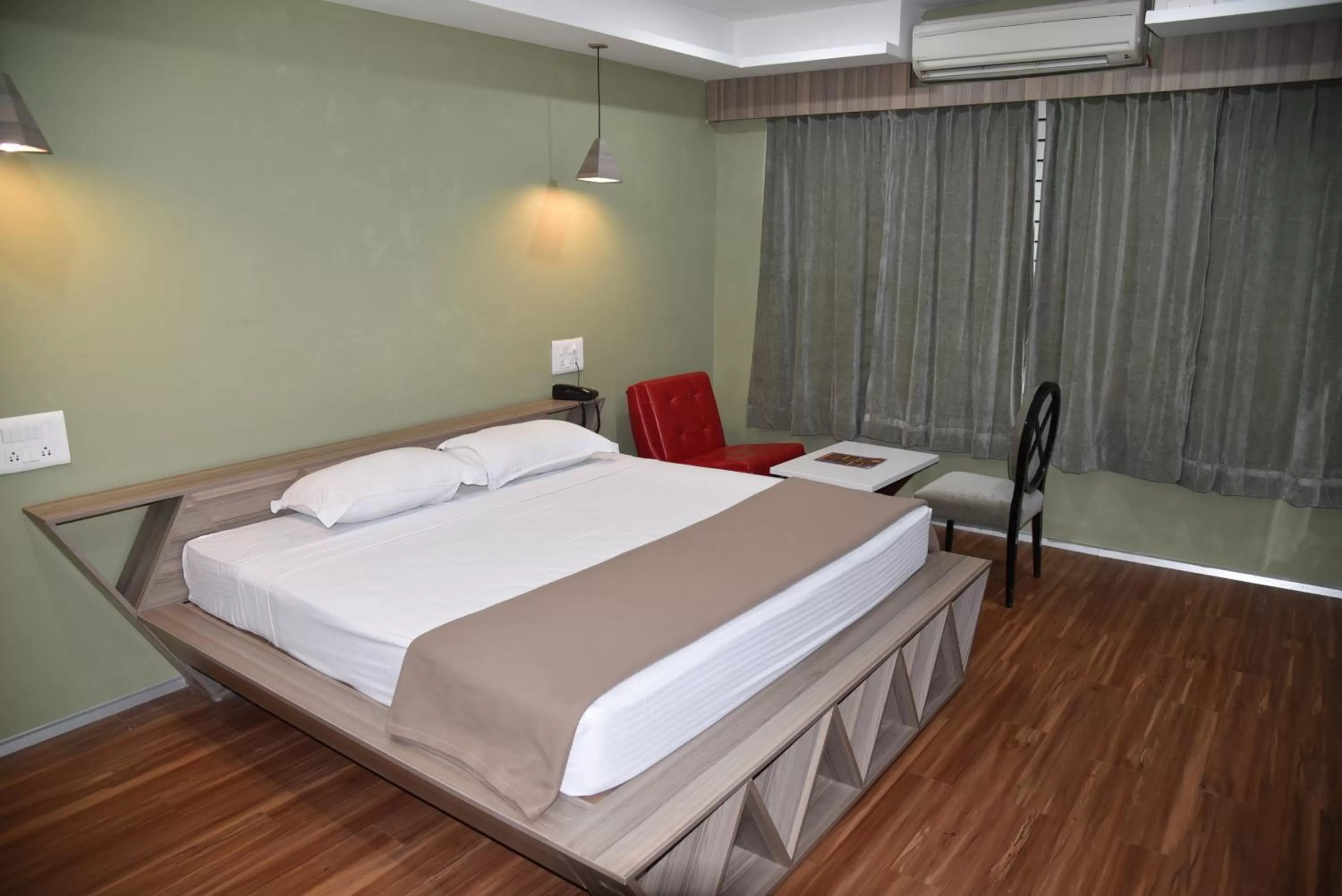 Bed in Hotel Bhimas Paradise