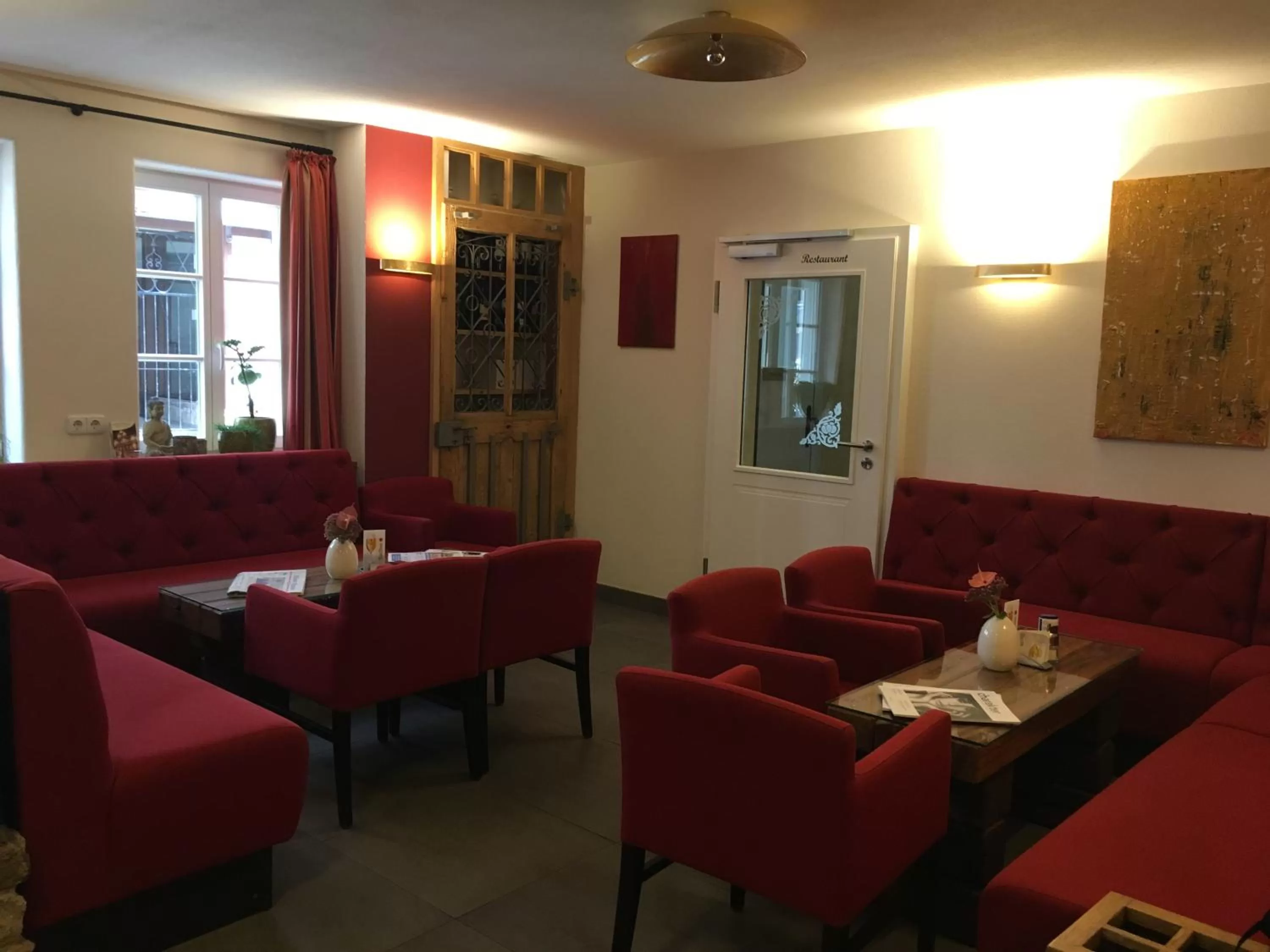 Communal lounge/ TV room in Fachwerk-Hotel Eisenbart