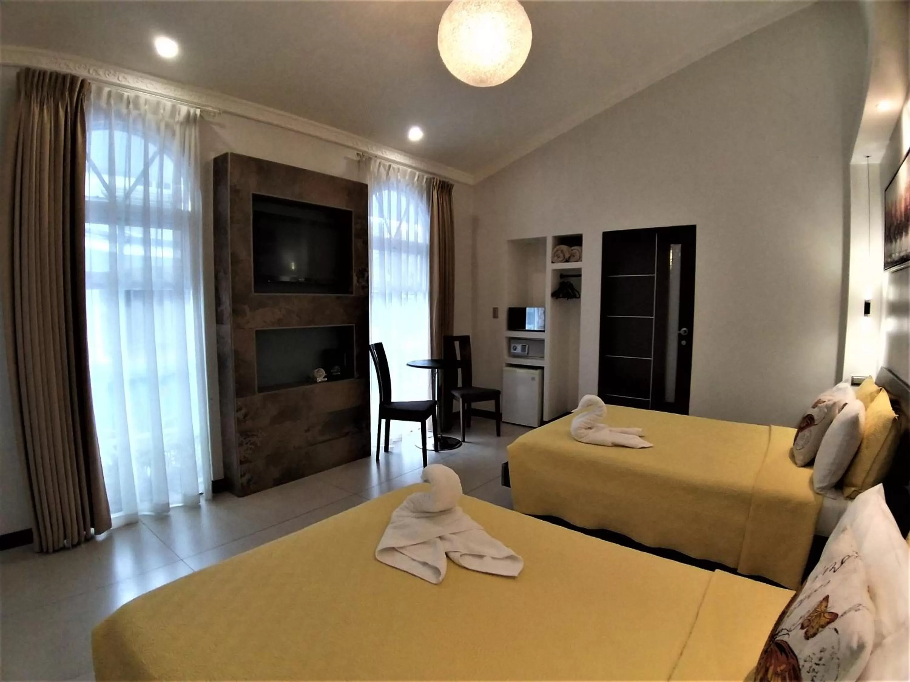 Photo of the whole room, Bed in Alameda Cariari Boutique Hotel