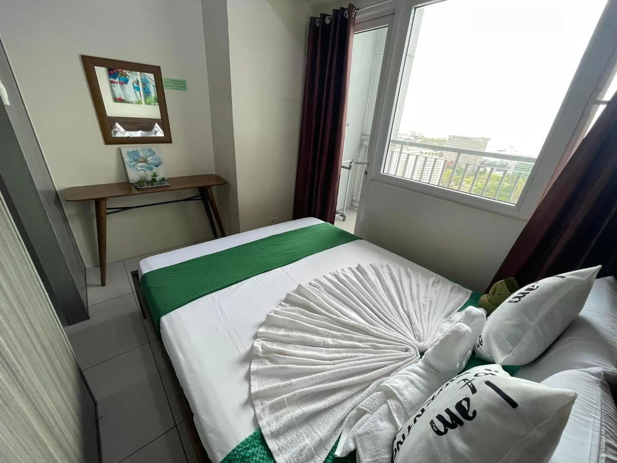 Bed in Green Residences Stays by PBYY