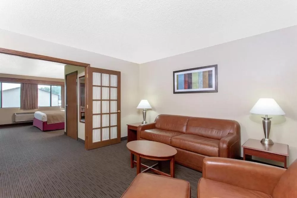 Living room in AmericInn by Wyndham New London