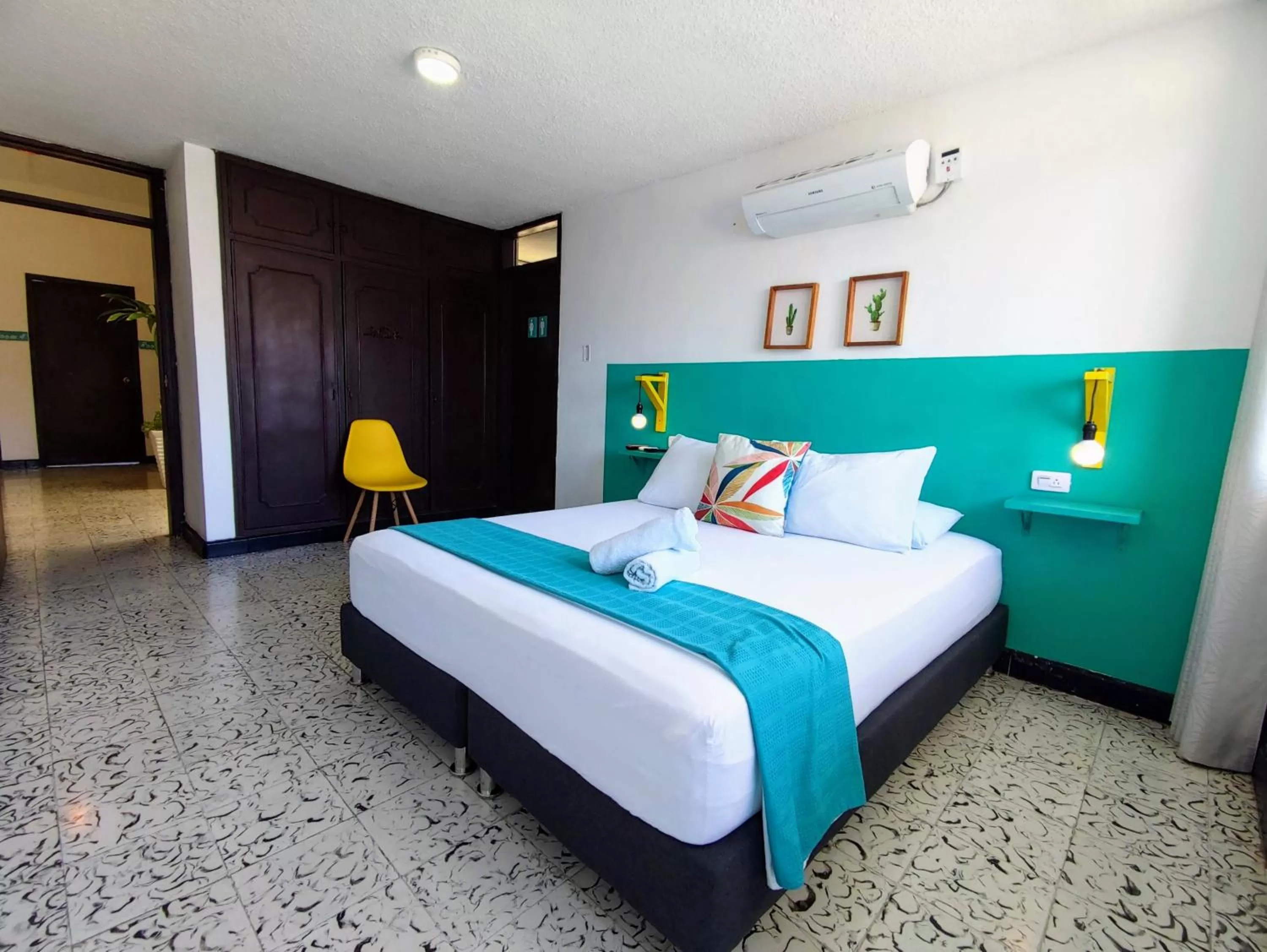 Bed in Bona Vida Hotel