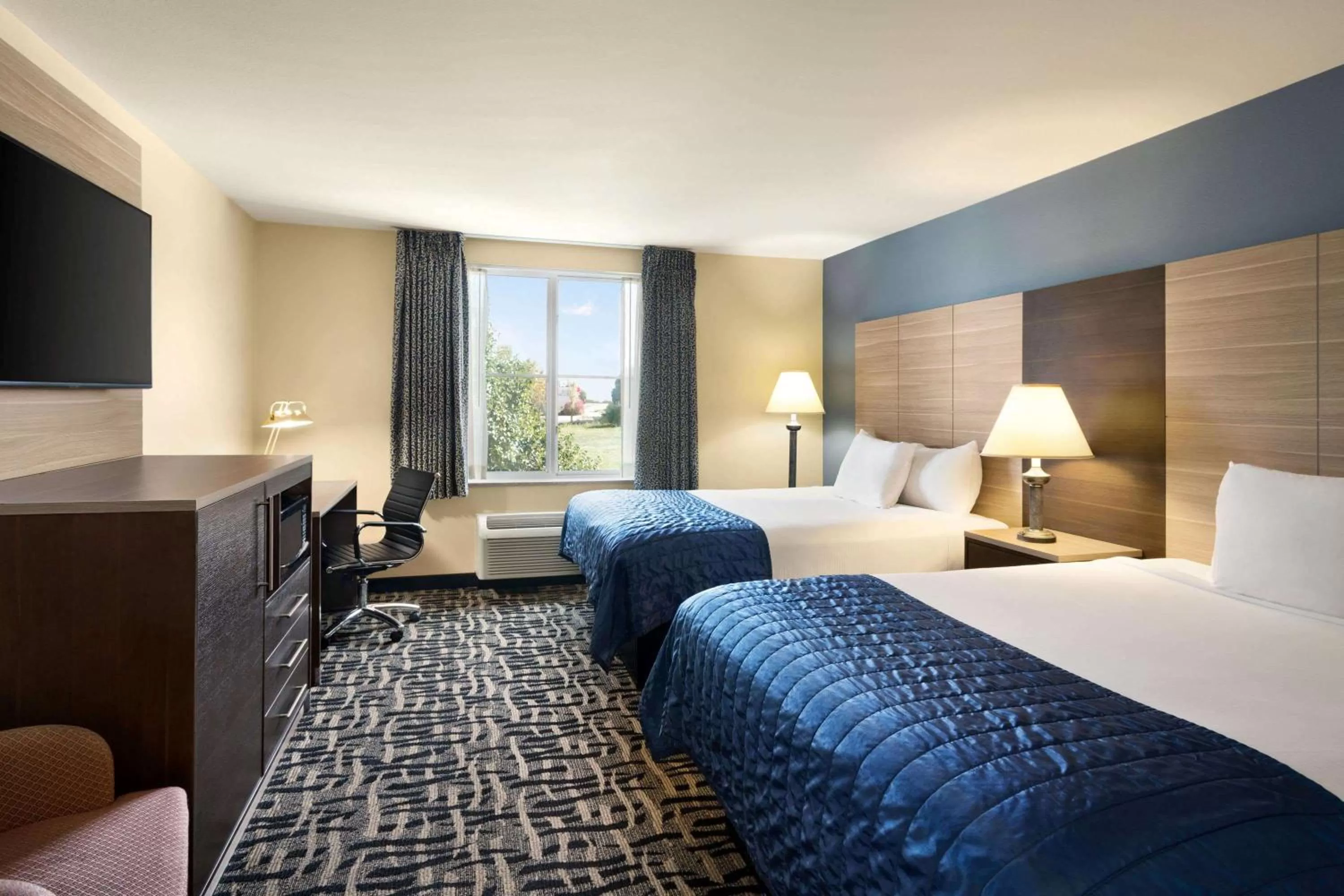 Photo of the whole room, Bed in Baymont by Wyndham Ft. Leonard/Saint Robert