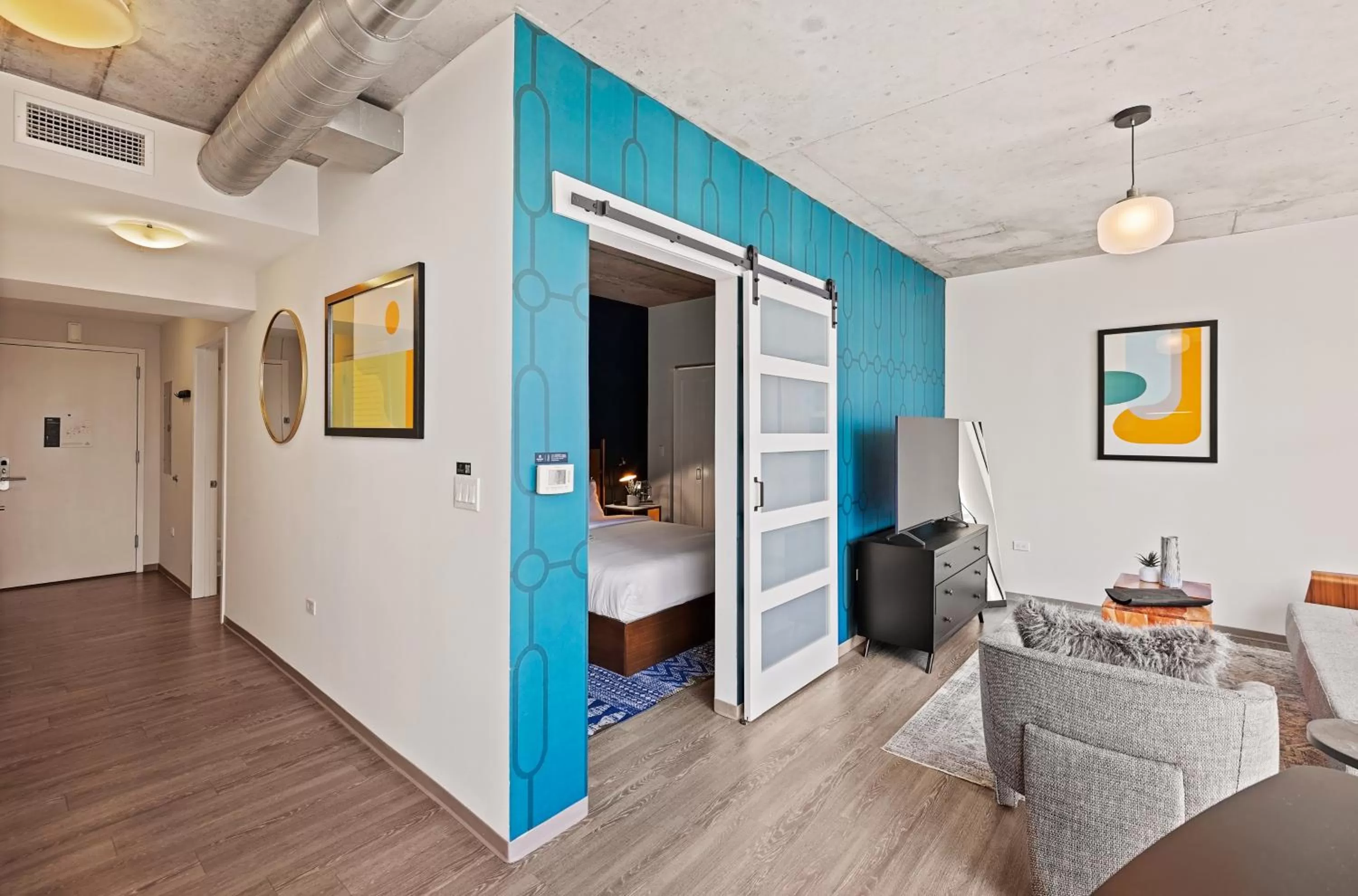 Living room, Bed in Placemakr Premier SoBro