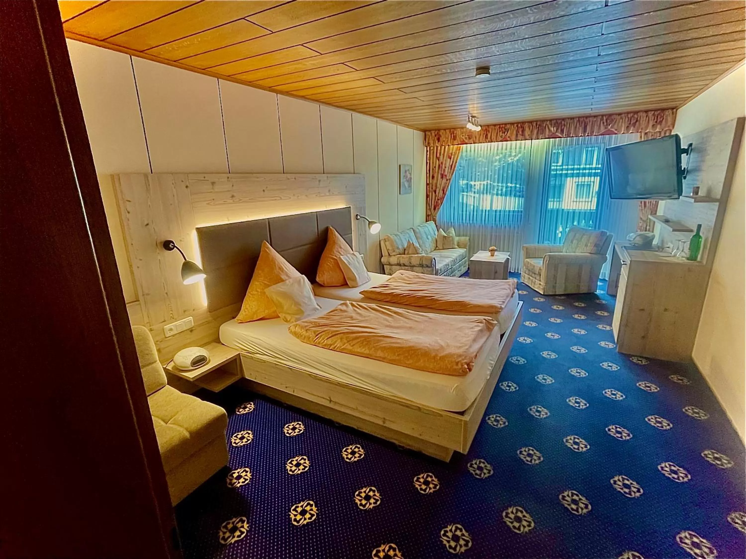 Living room, Bed in Sporthotel Göbel Garni