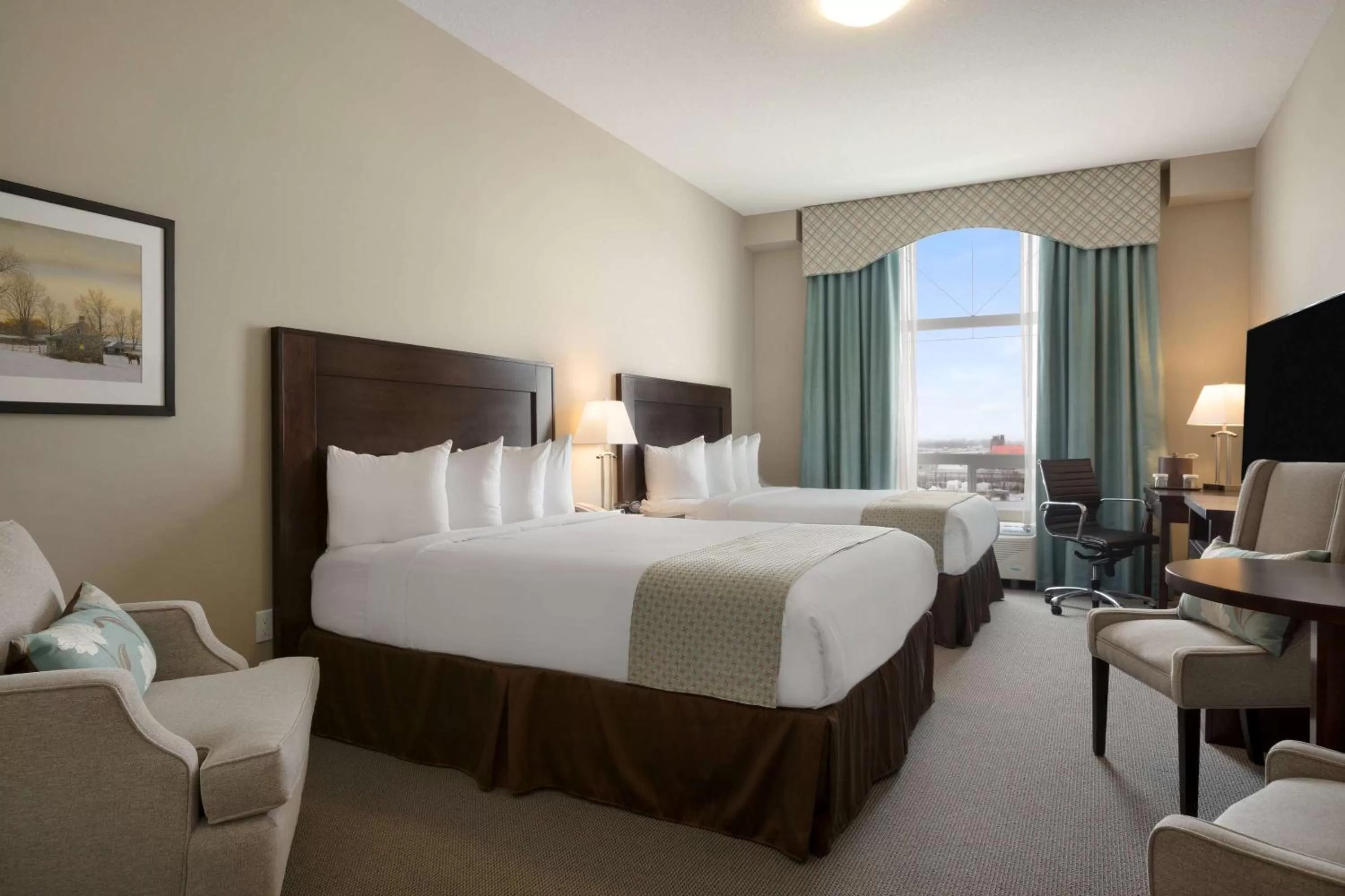 Photo of the whole room, Bed in Ramada by Wyndham Emerald Park/Regina East