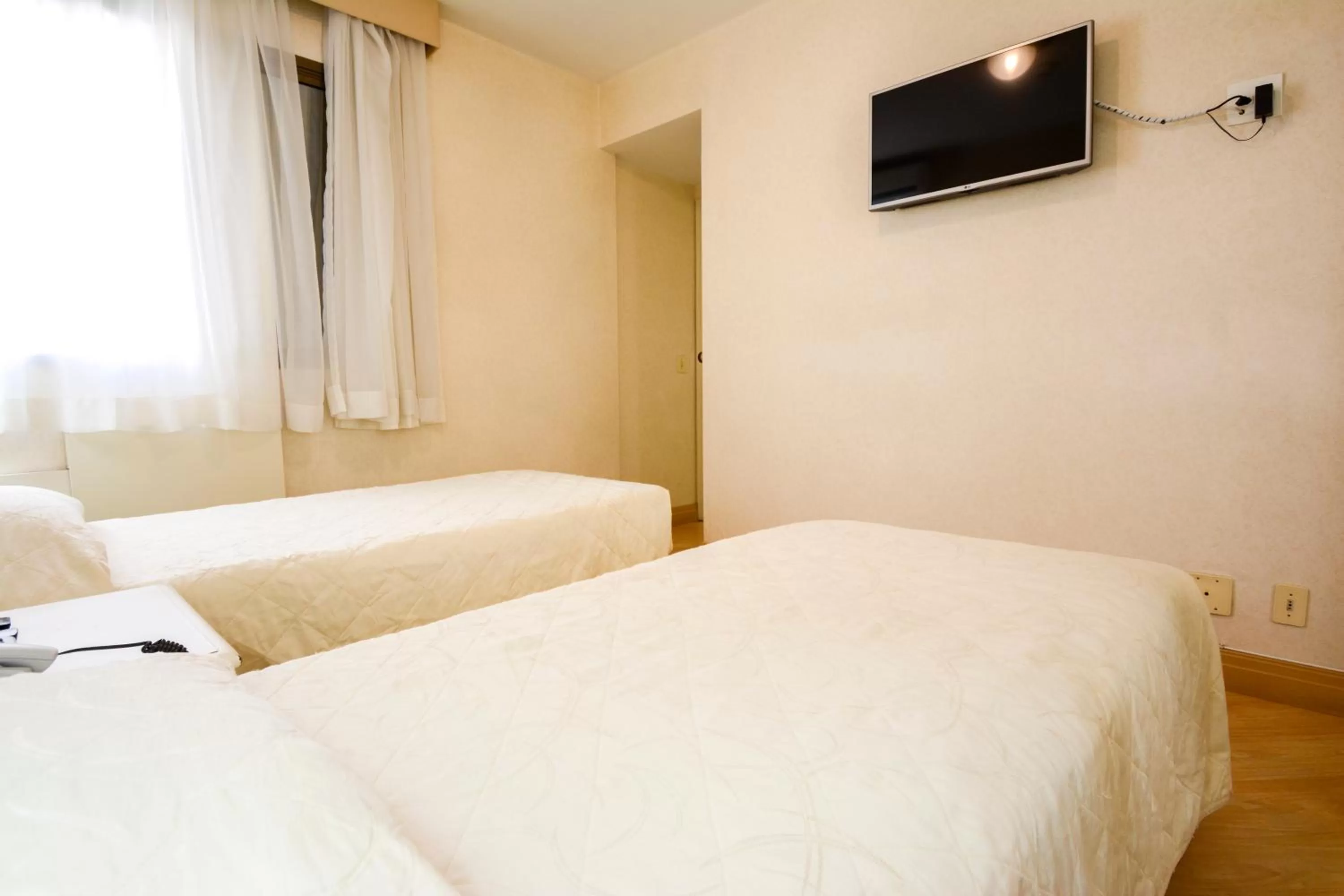 Bed in Wall Street Apartments by BnbHost