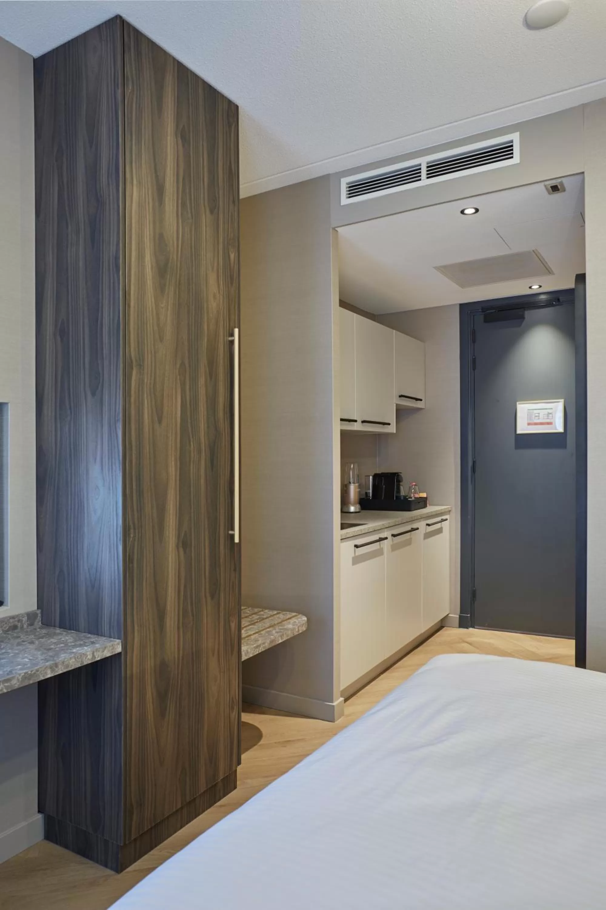 Kitchen or kitchenette, Bed in Breathe Boutique Hotel