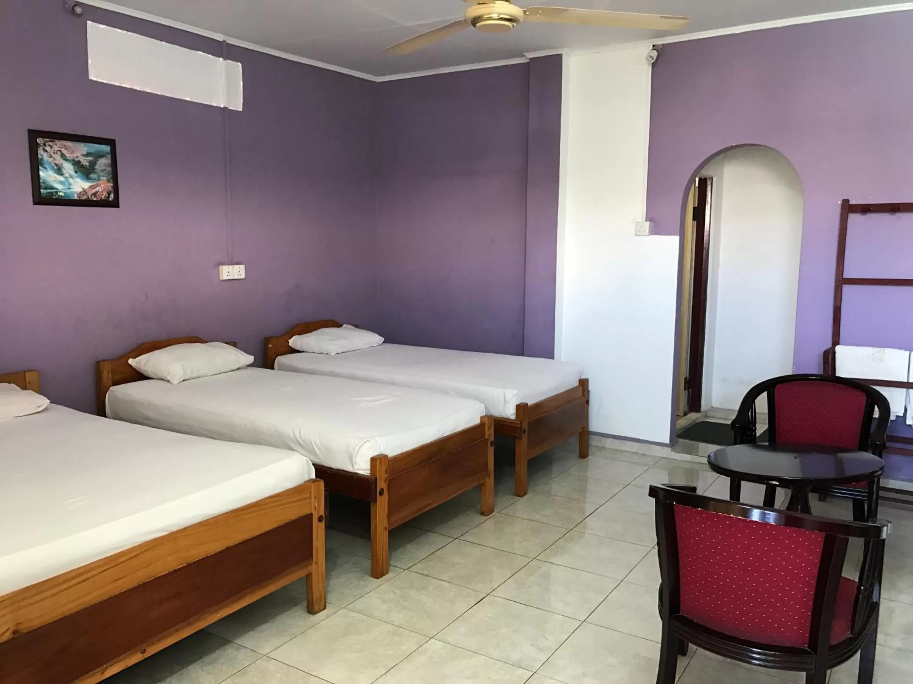 Bed in Gnaanams Hotel and Restaurant