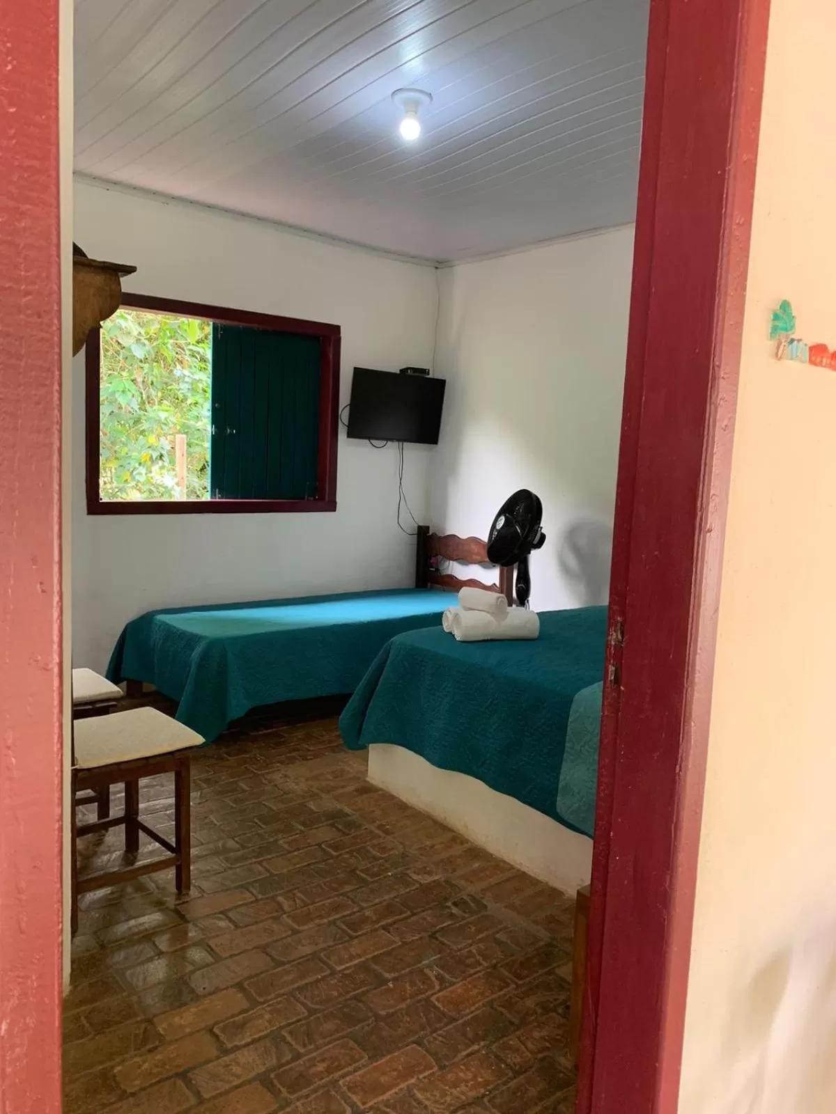 Bed in Pousada Cantinho do Mundo