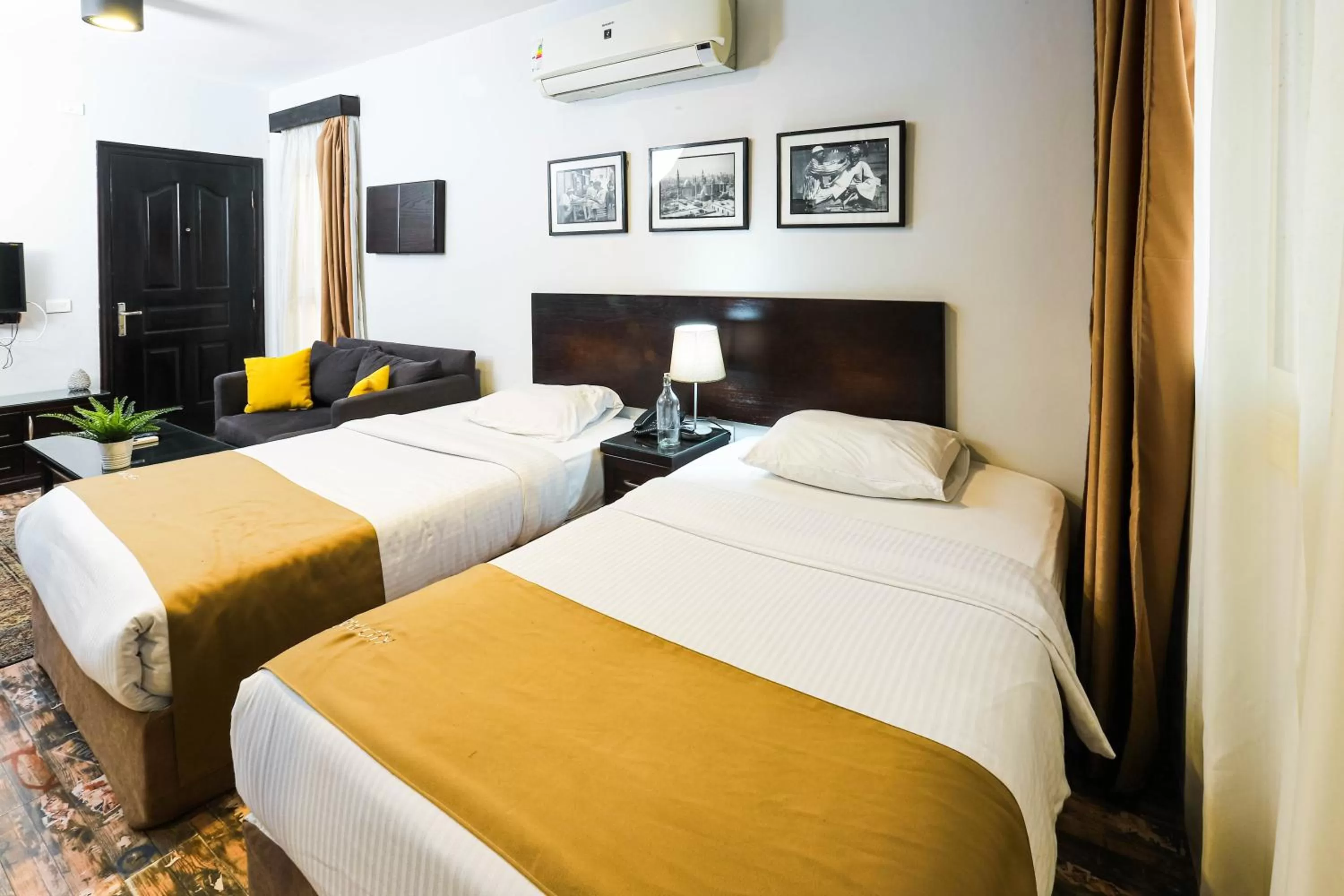 Photo of the whole room, Bed in NewCity Hotel & Suites