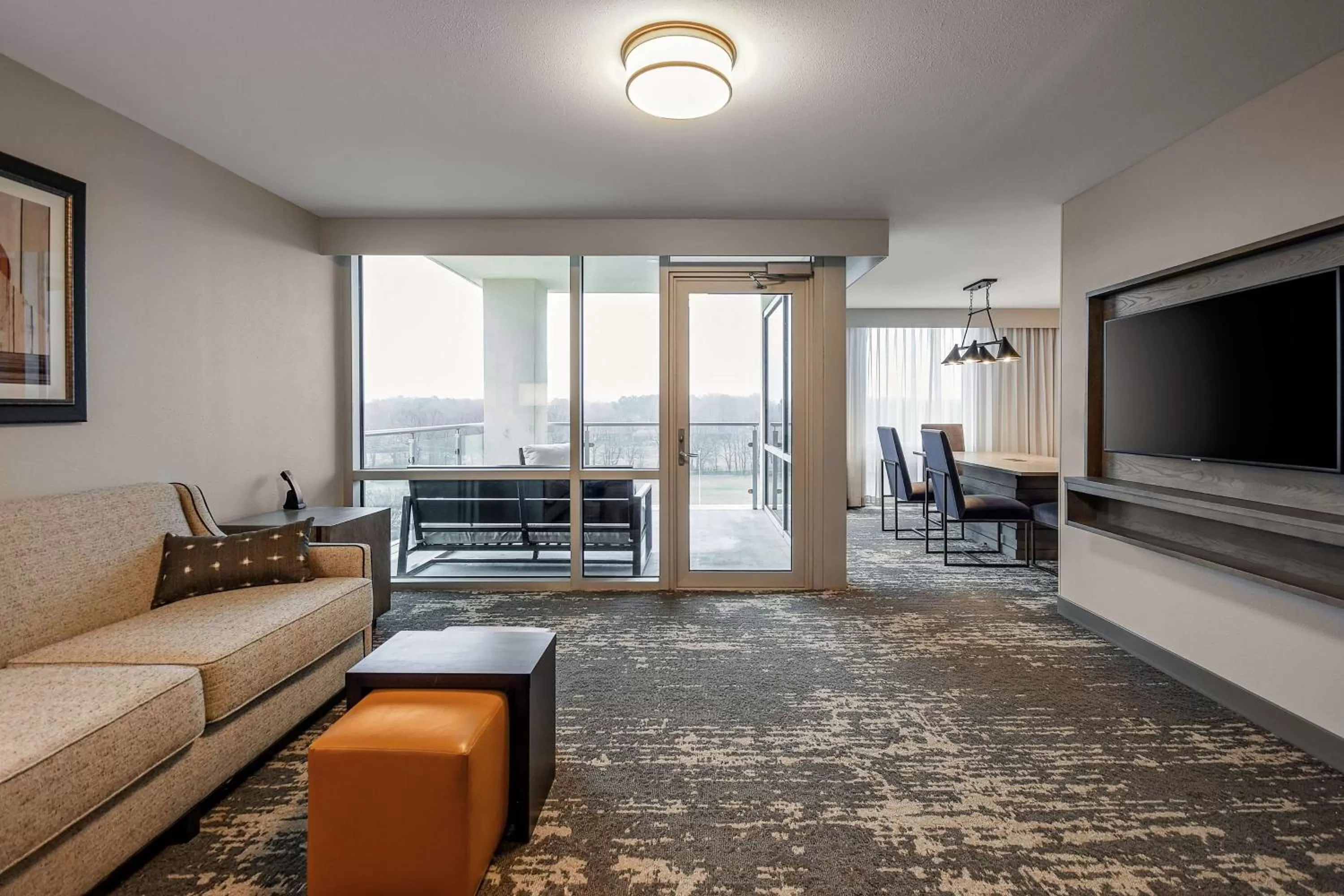 Living room in Embassy Suites by Hilton Jonesboro Red Wolf Convention Center