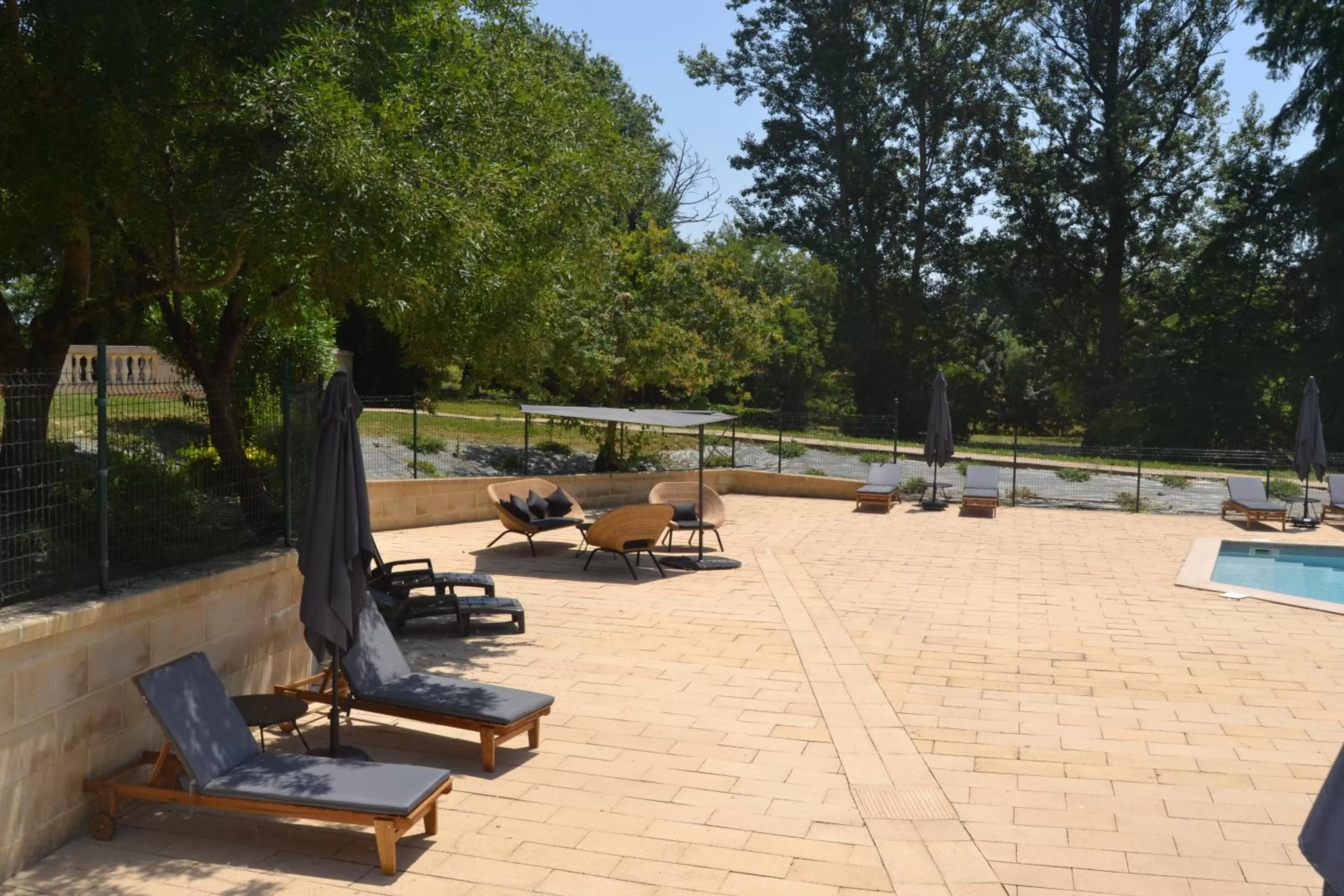 Swimming pool in Logis Hotels - Château Saint Marcel