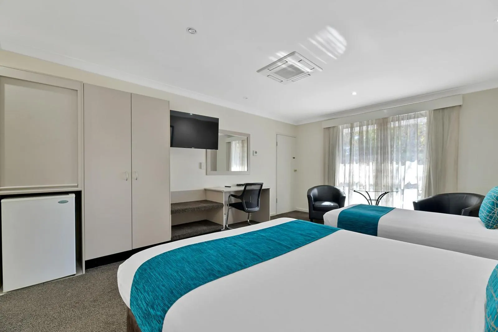 Bed in Central Caleula Motor Lodge