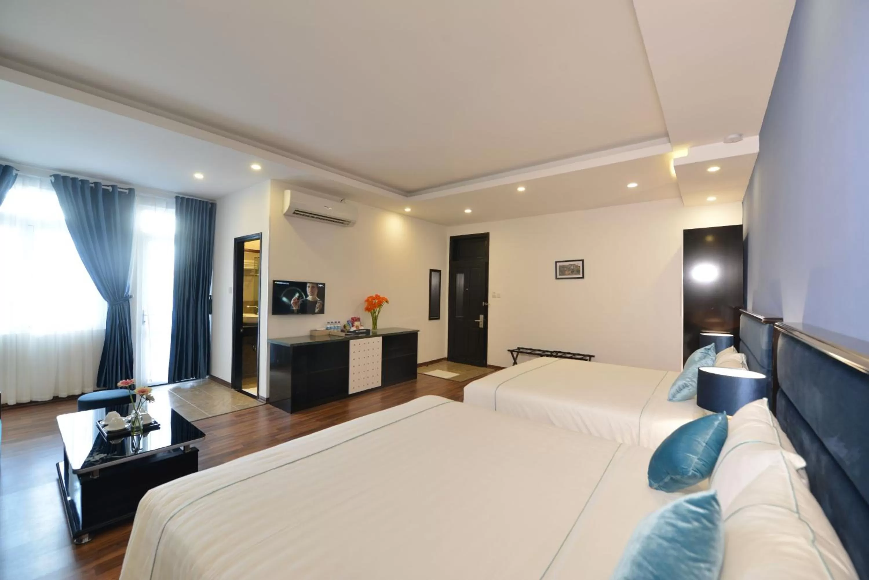 Photo of the whole room, Bed in TTC Hotel - Hoi An