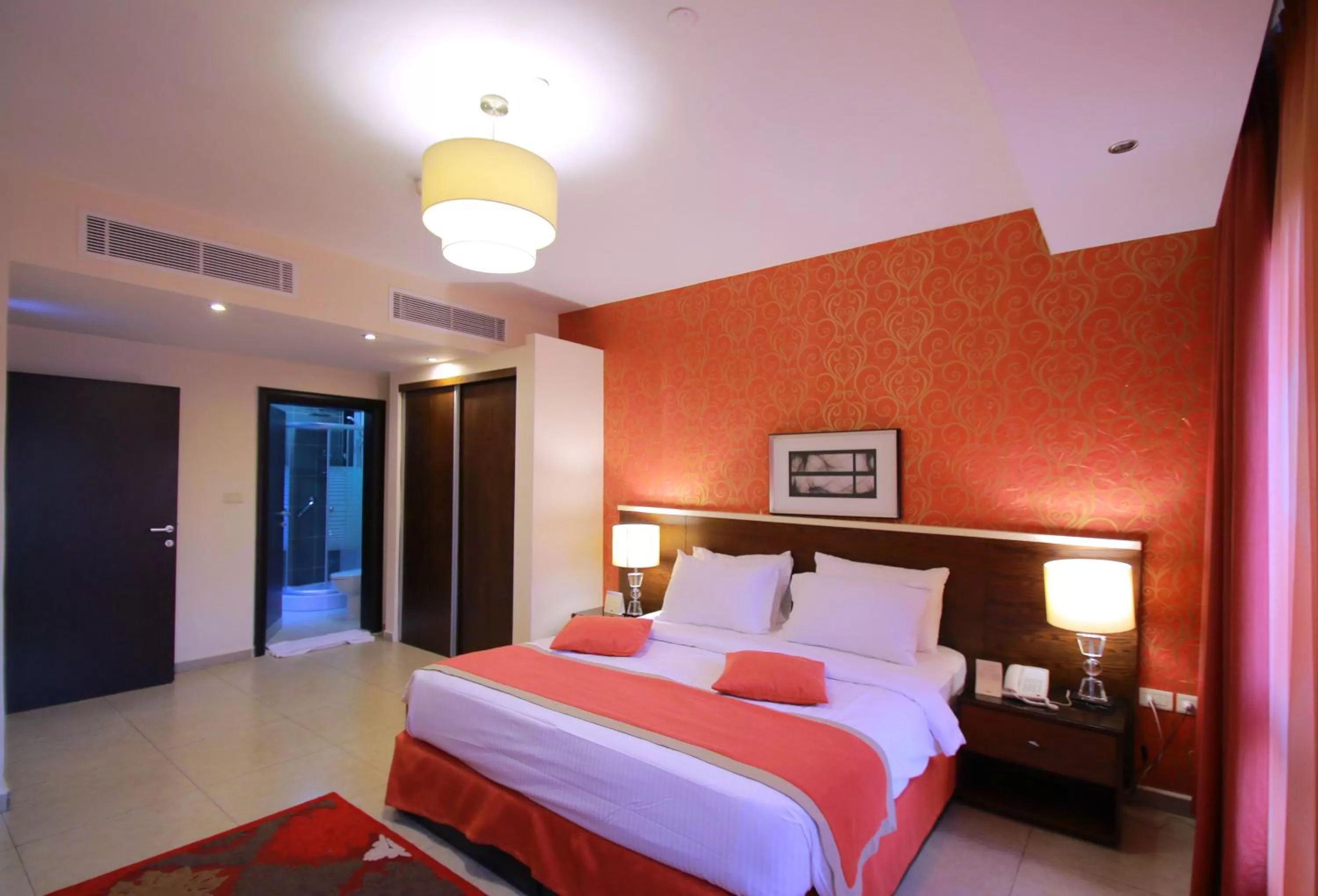 Bed in City Rose Hotel Suites