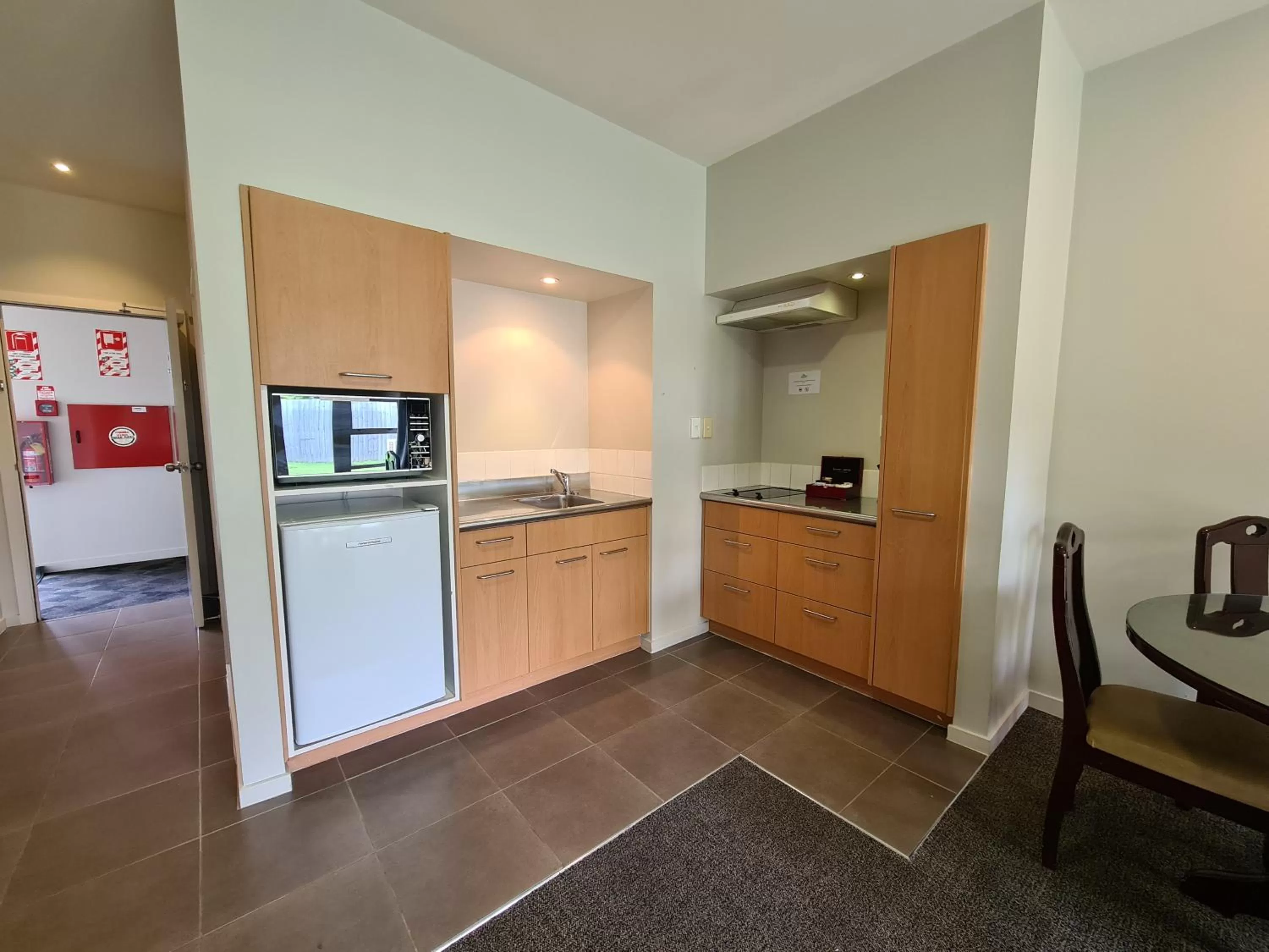 Kitchen or kitchenette in The Garden Hotel