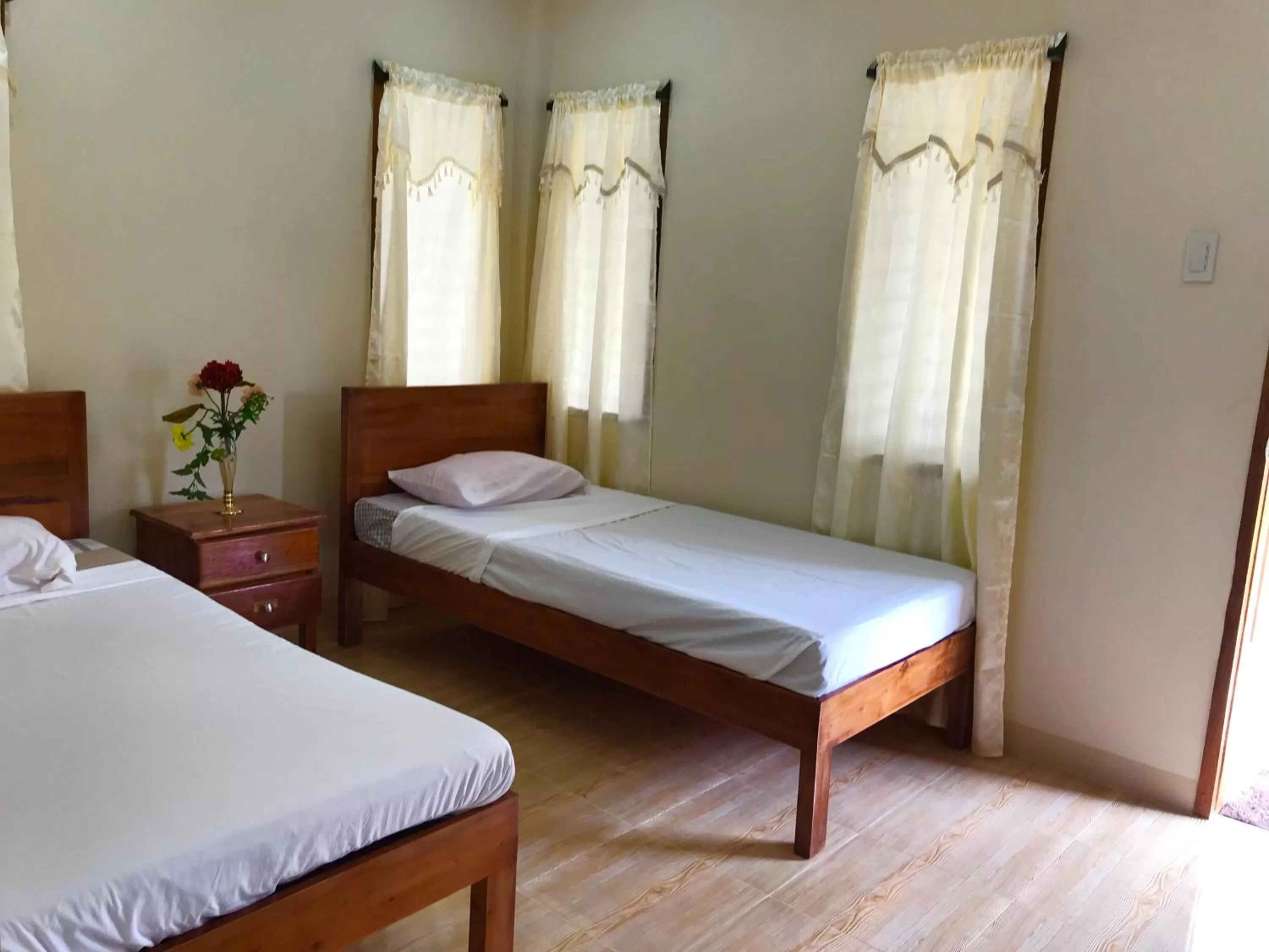 Bed in D's Oceanview Beach Resort