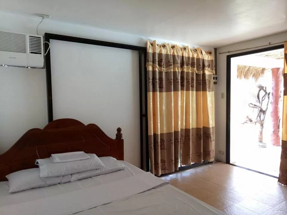 Bed in Camaya-an Paradise Beach Resort