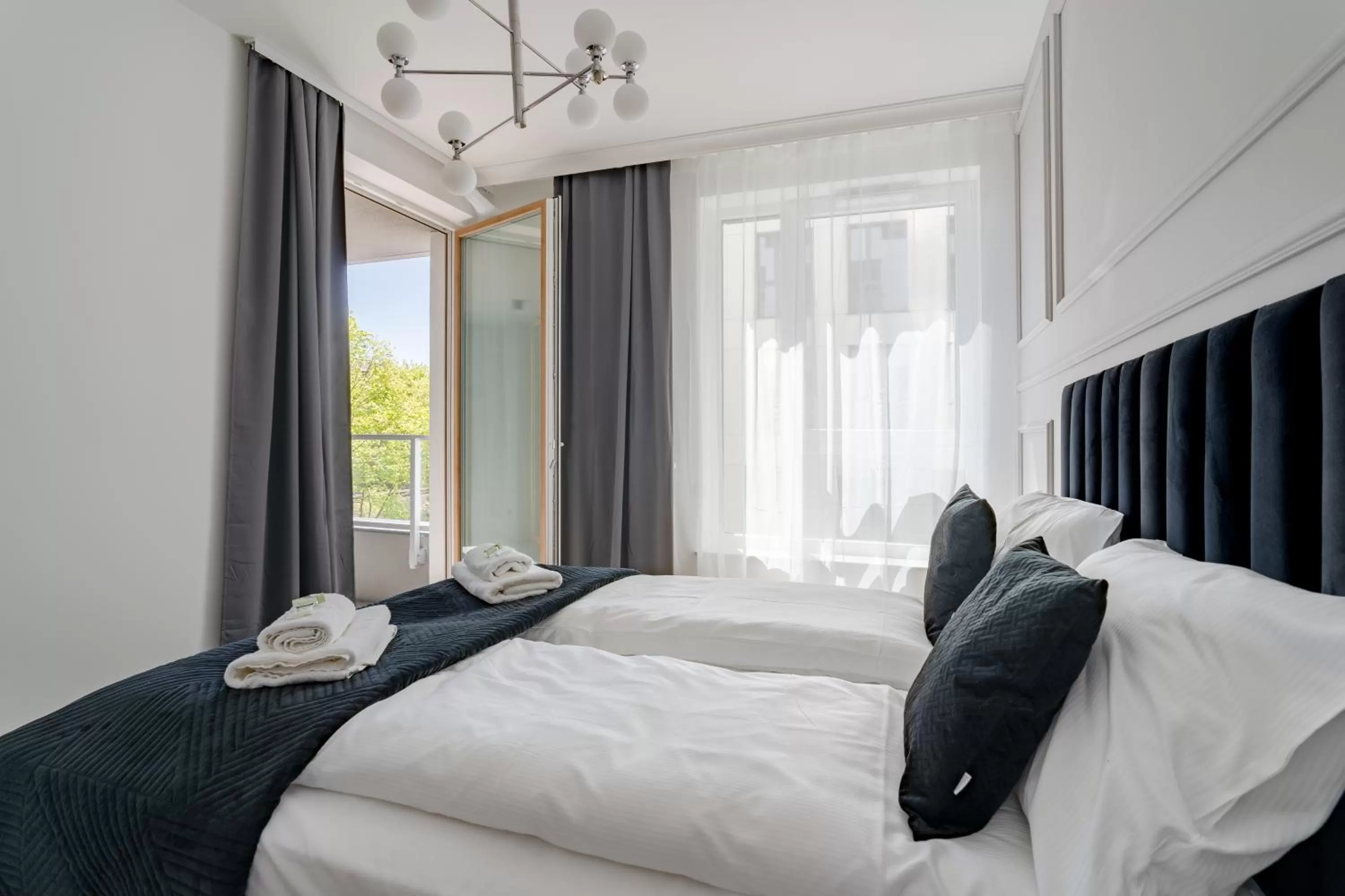 Bed in Symphony Modern Tower Apartamenty