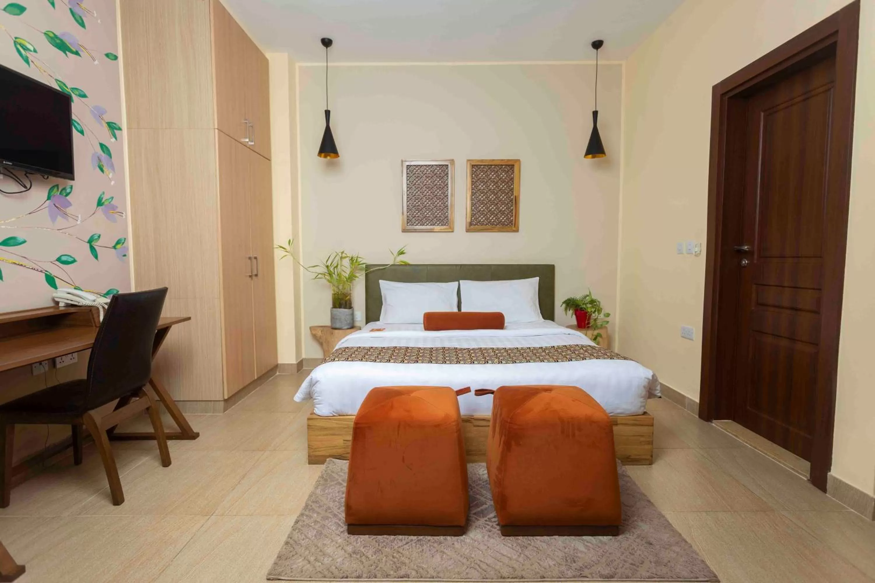 Bed in Roots Hotel Apartment