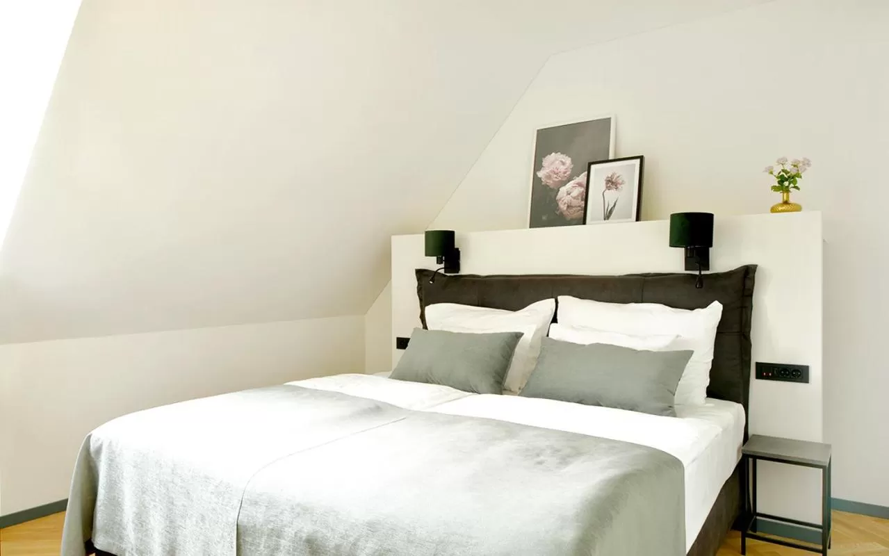 Bed in Hotel Maribor & Garden Rooms