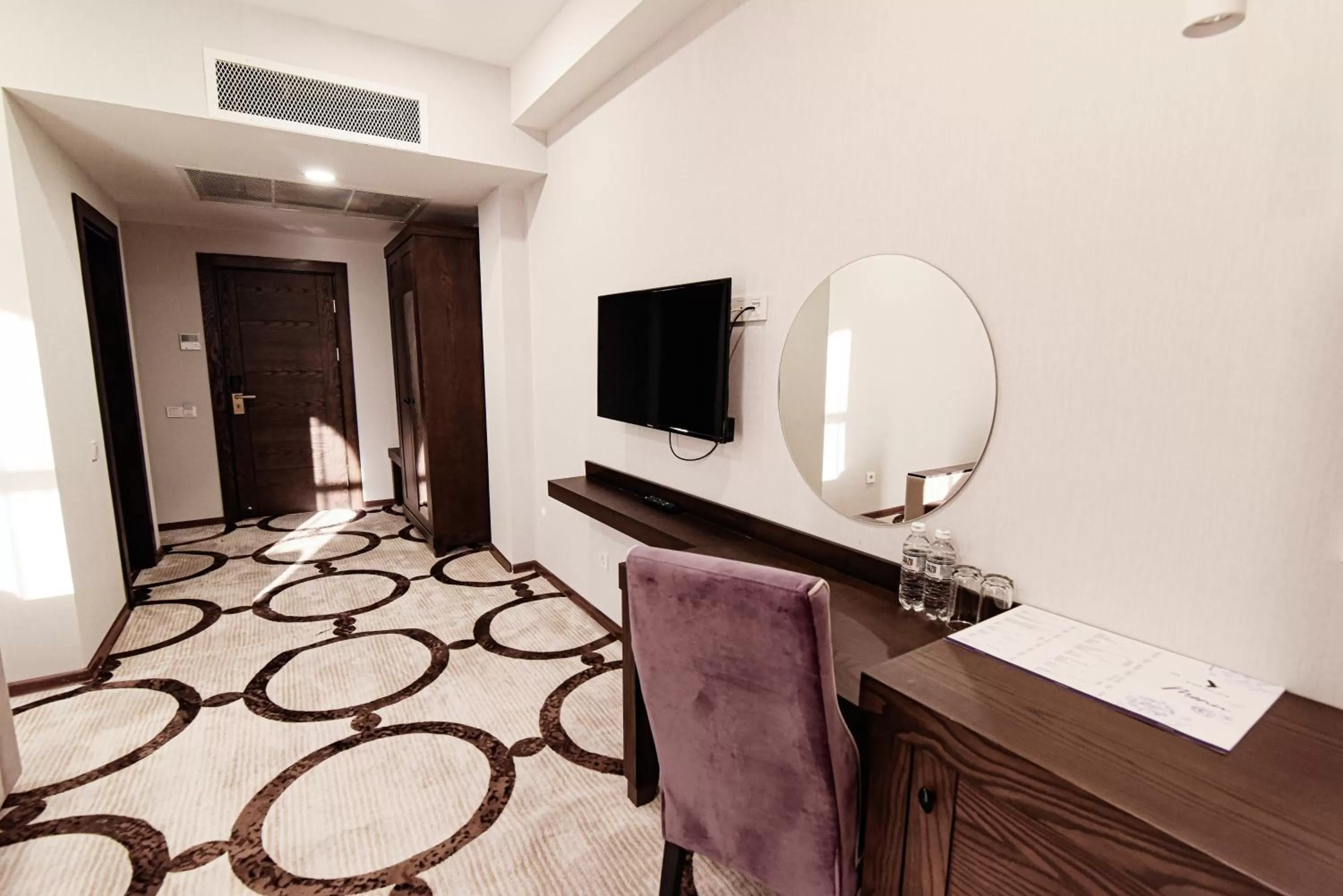 Communal lounge/ TV room in East Palace Hotel