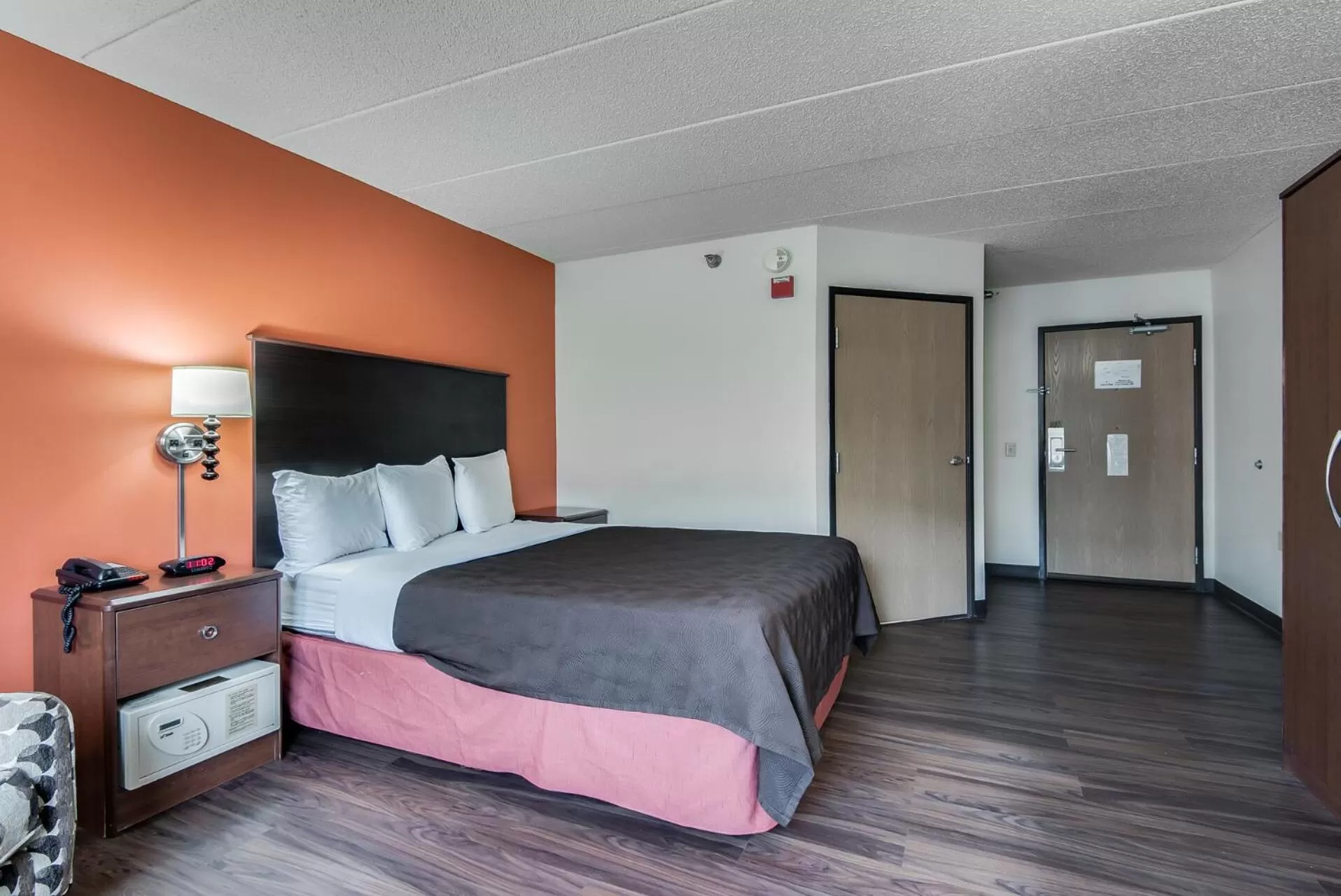 Bed in AmericInn by Wyndham Coon Rapids