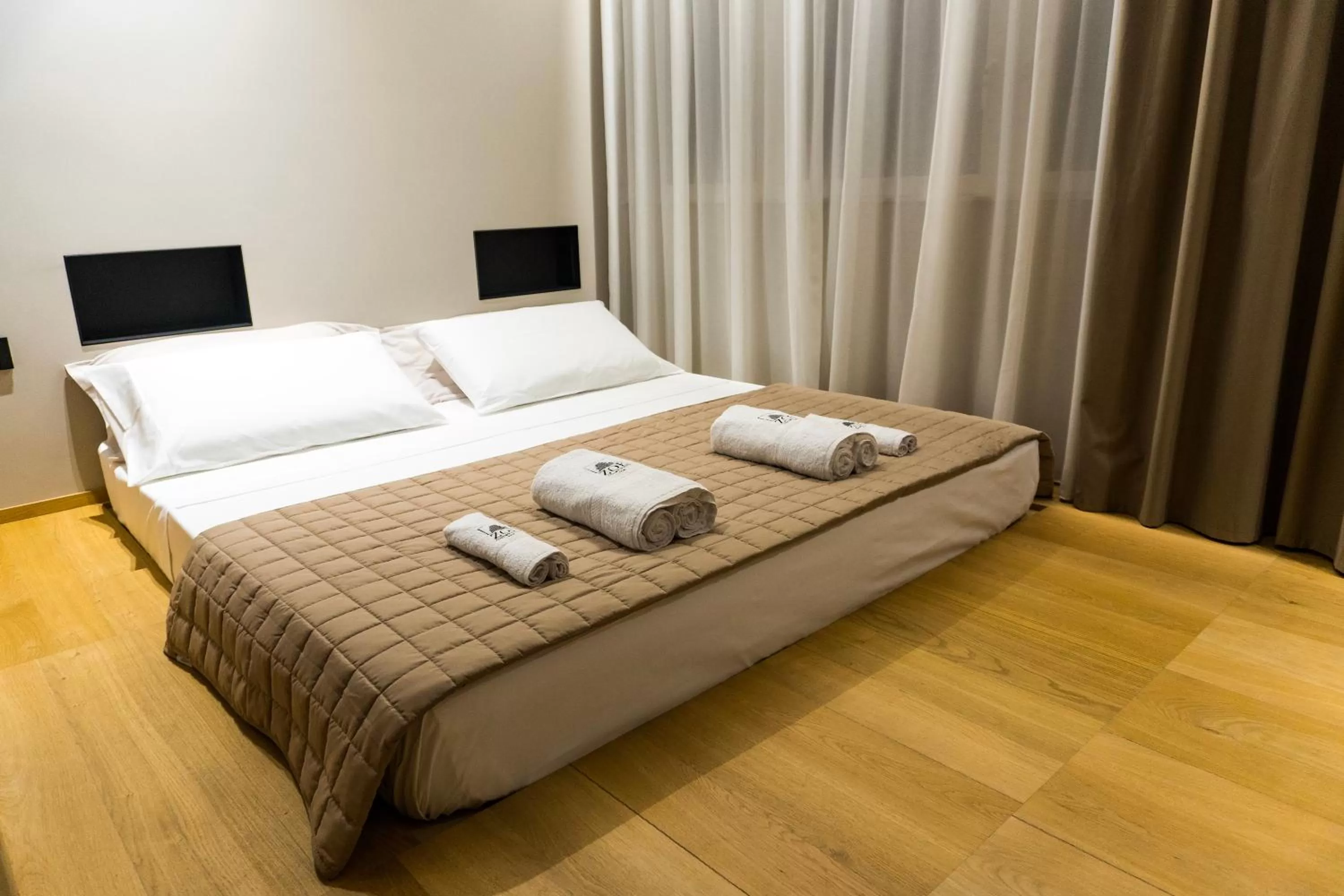 Bed in ZOE LUXURY SUITES