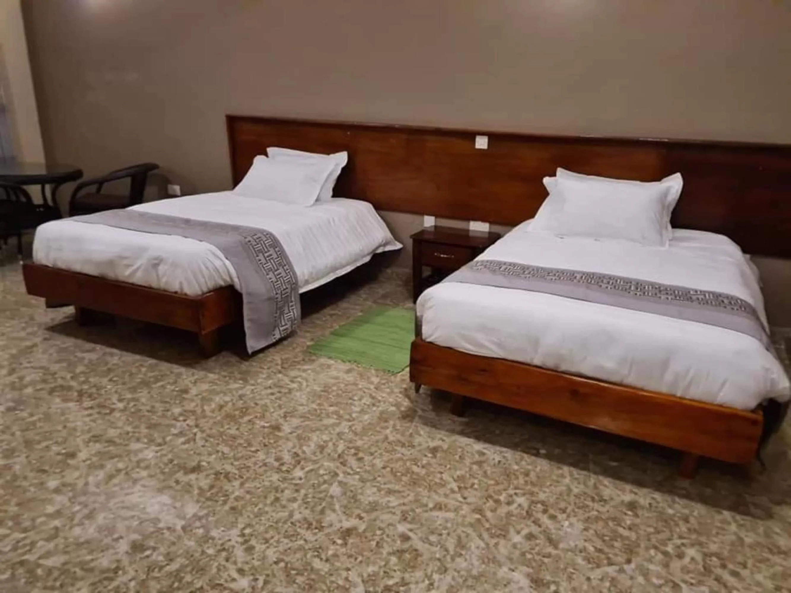 Bed in Bunyonyi Overland Resort