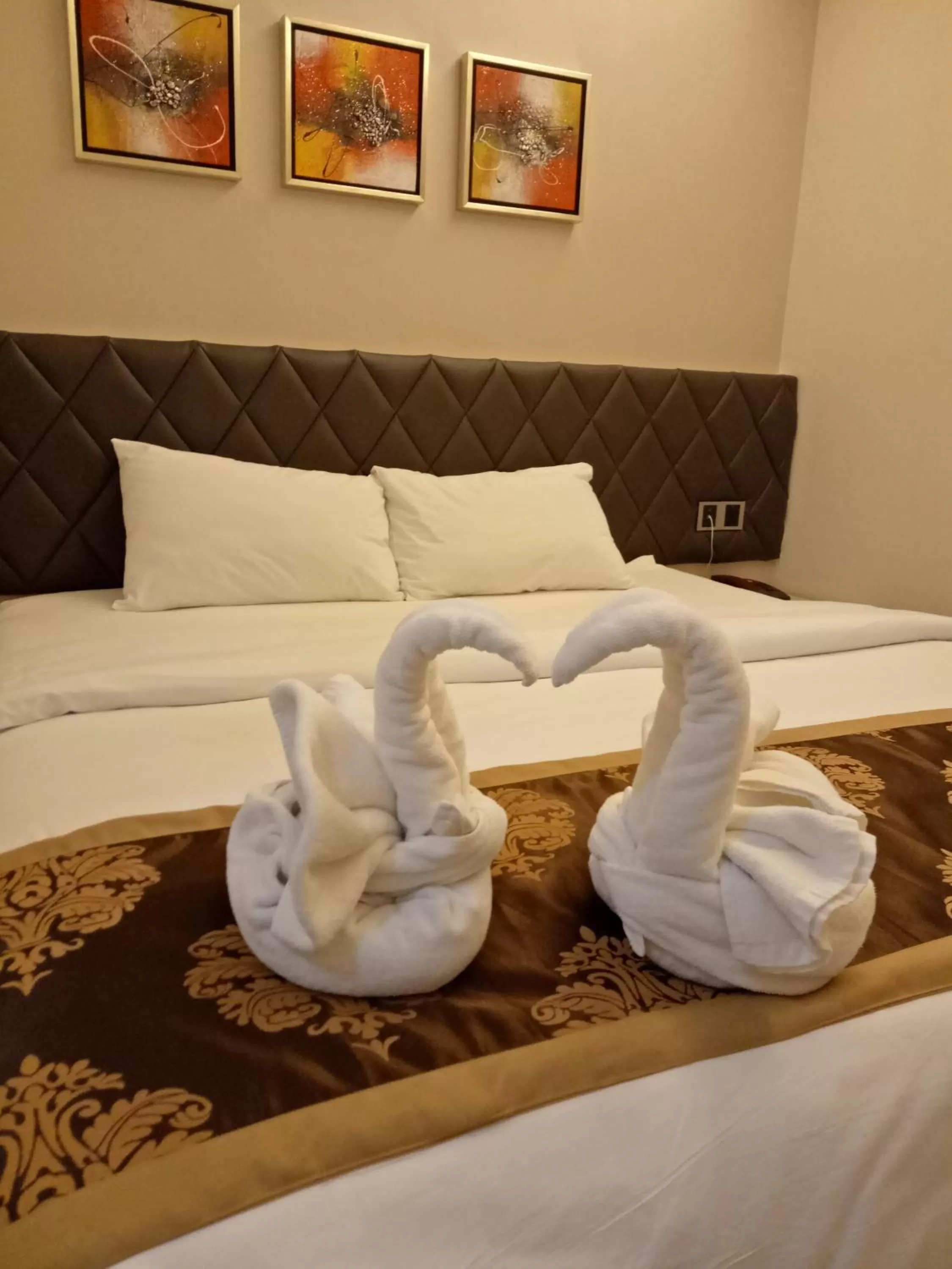 Bed in Golden Leaves Hotel