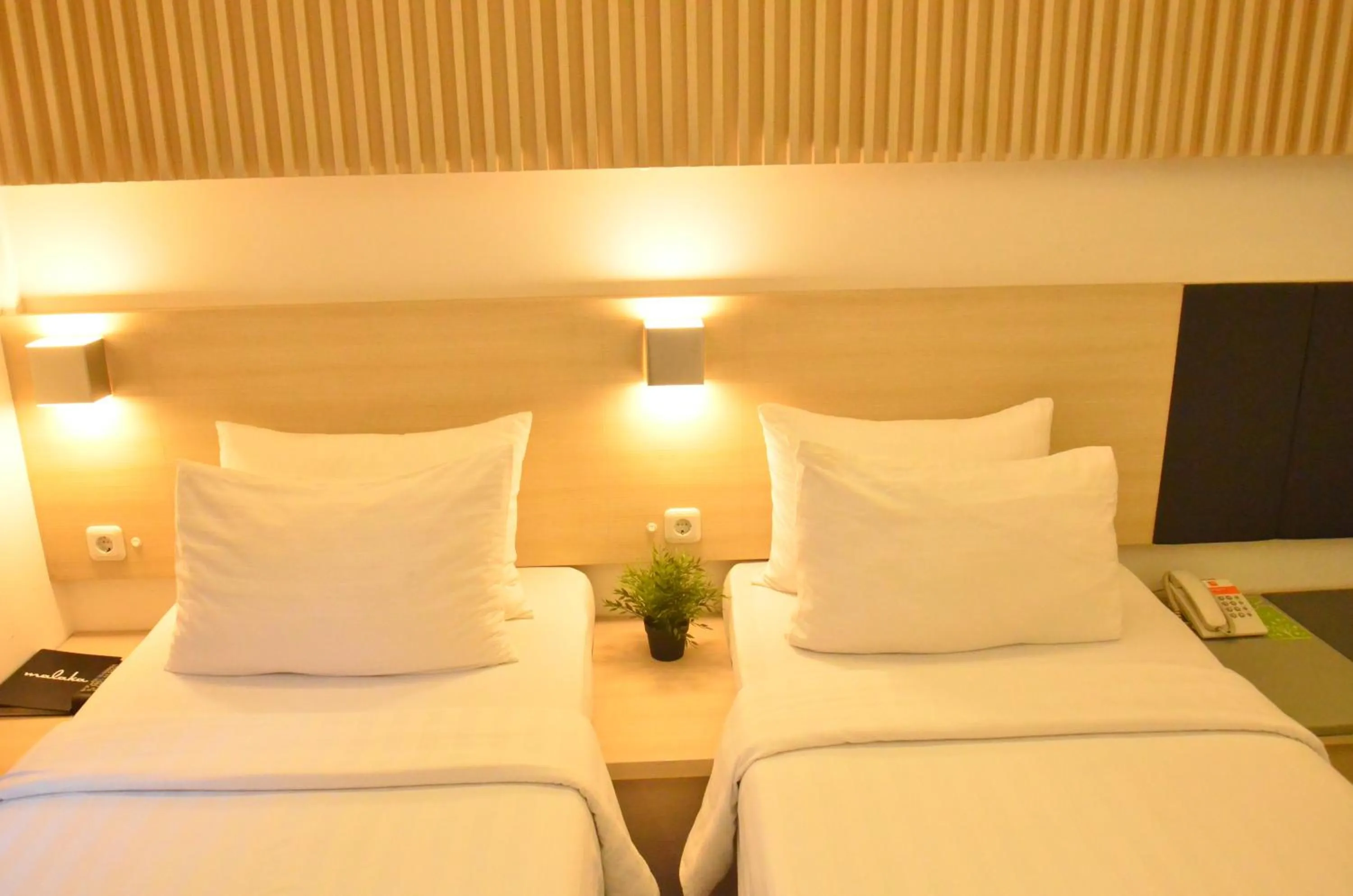 Bed in Malaka Hotel Bandung