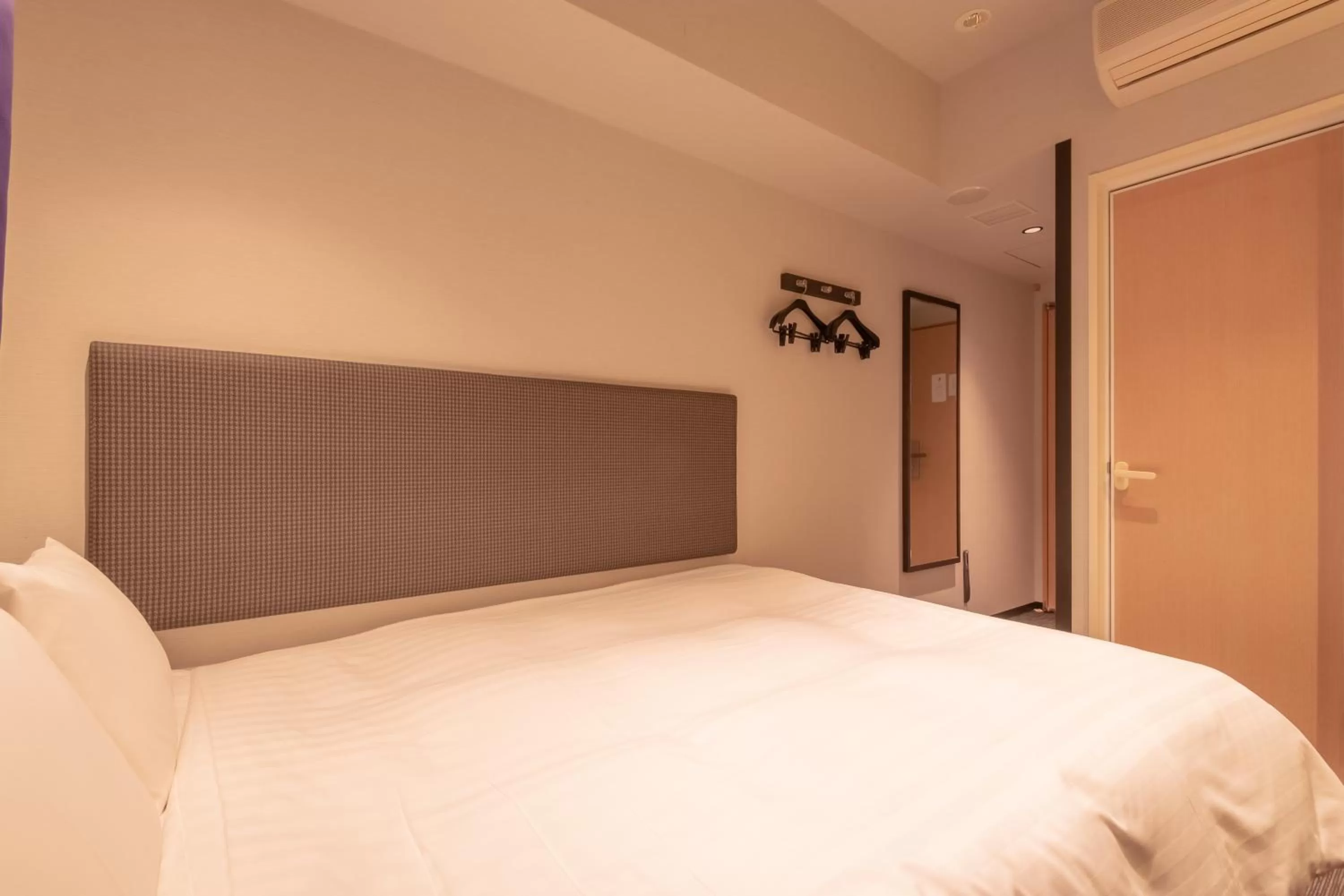 Bed in E Hotel Higashi Shinjuku